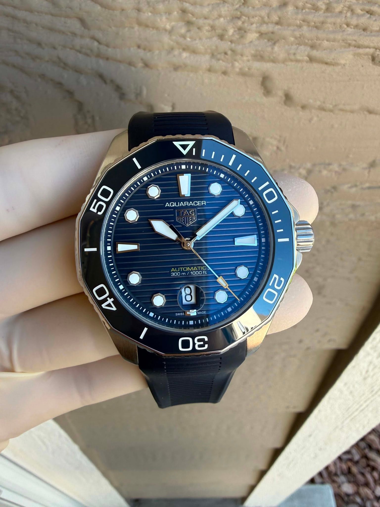 May be an image of wrist watch and text that says 'AQL AQUARACER 50 10 / OMATIC m ယ0 3'