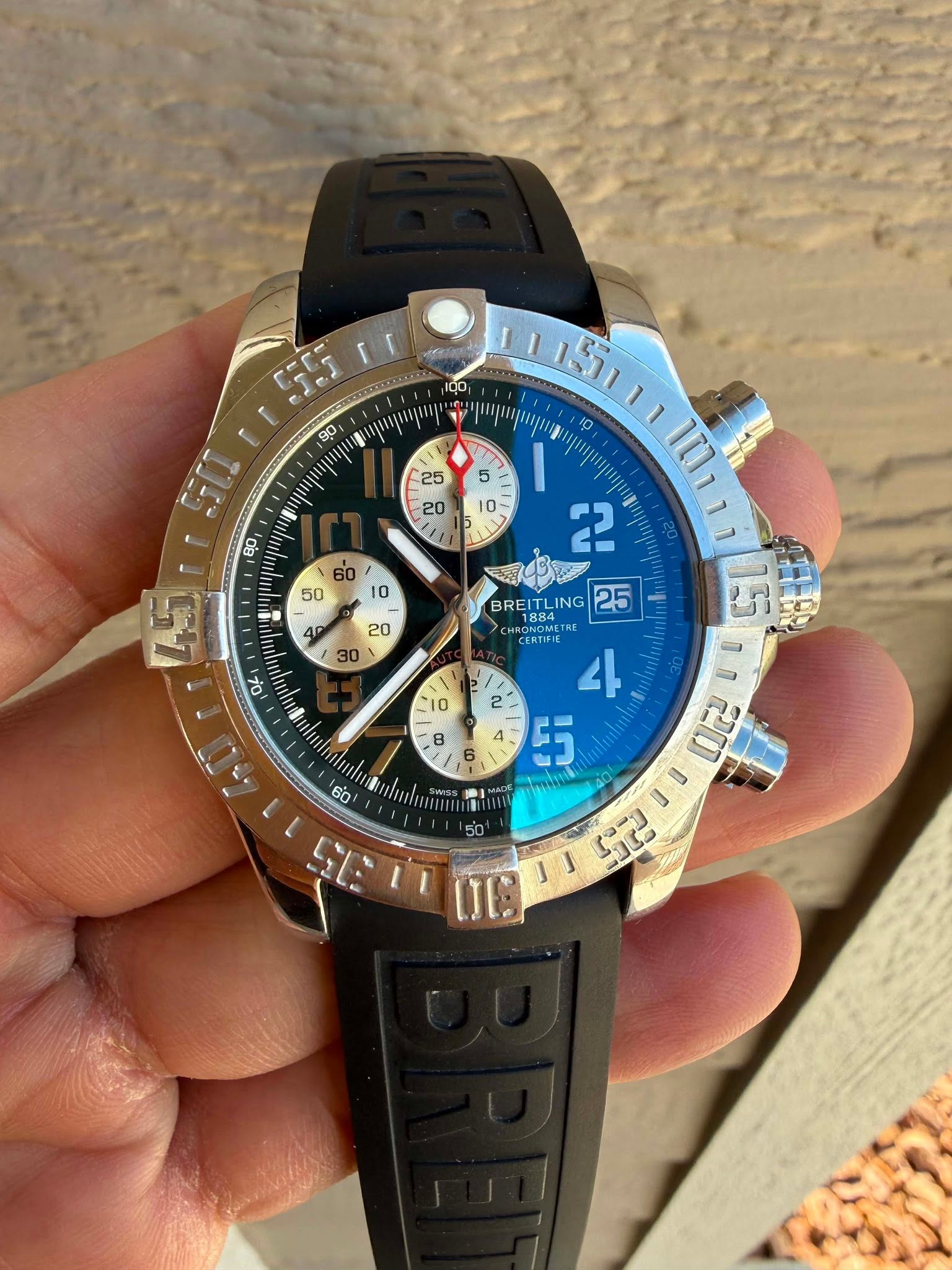May be an image of wrist watch and text