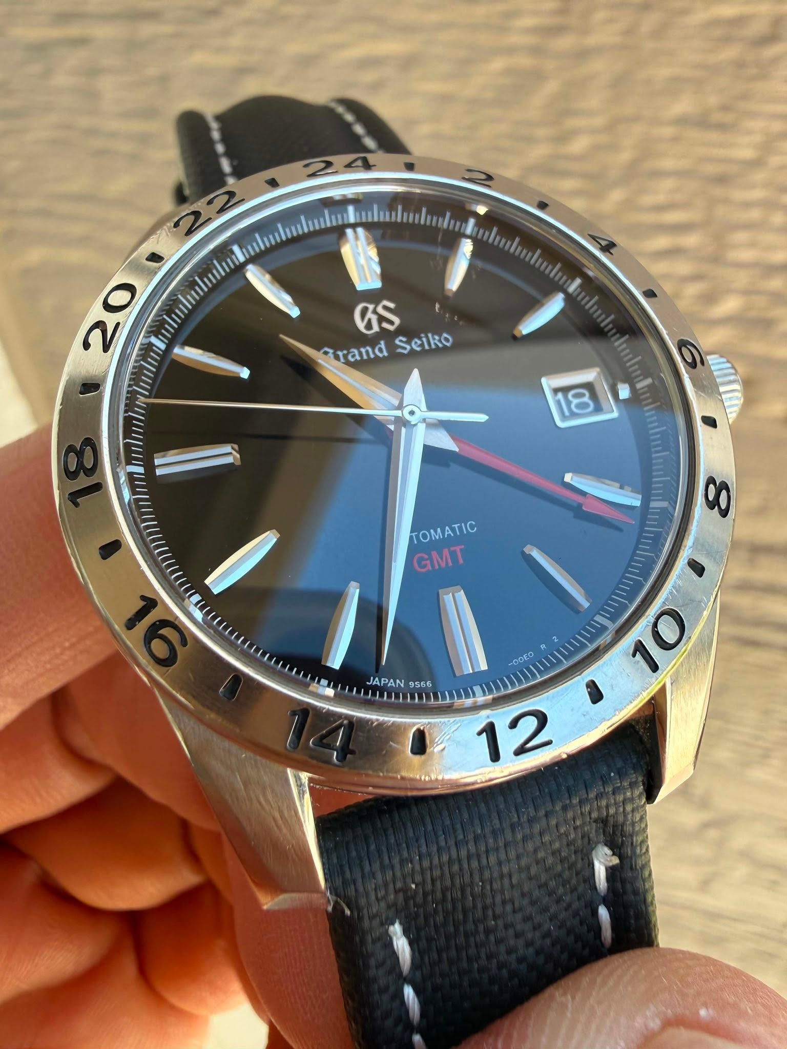May be an image of wrist watch and text