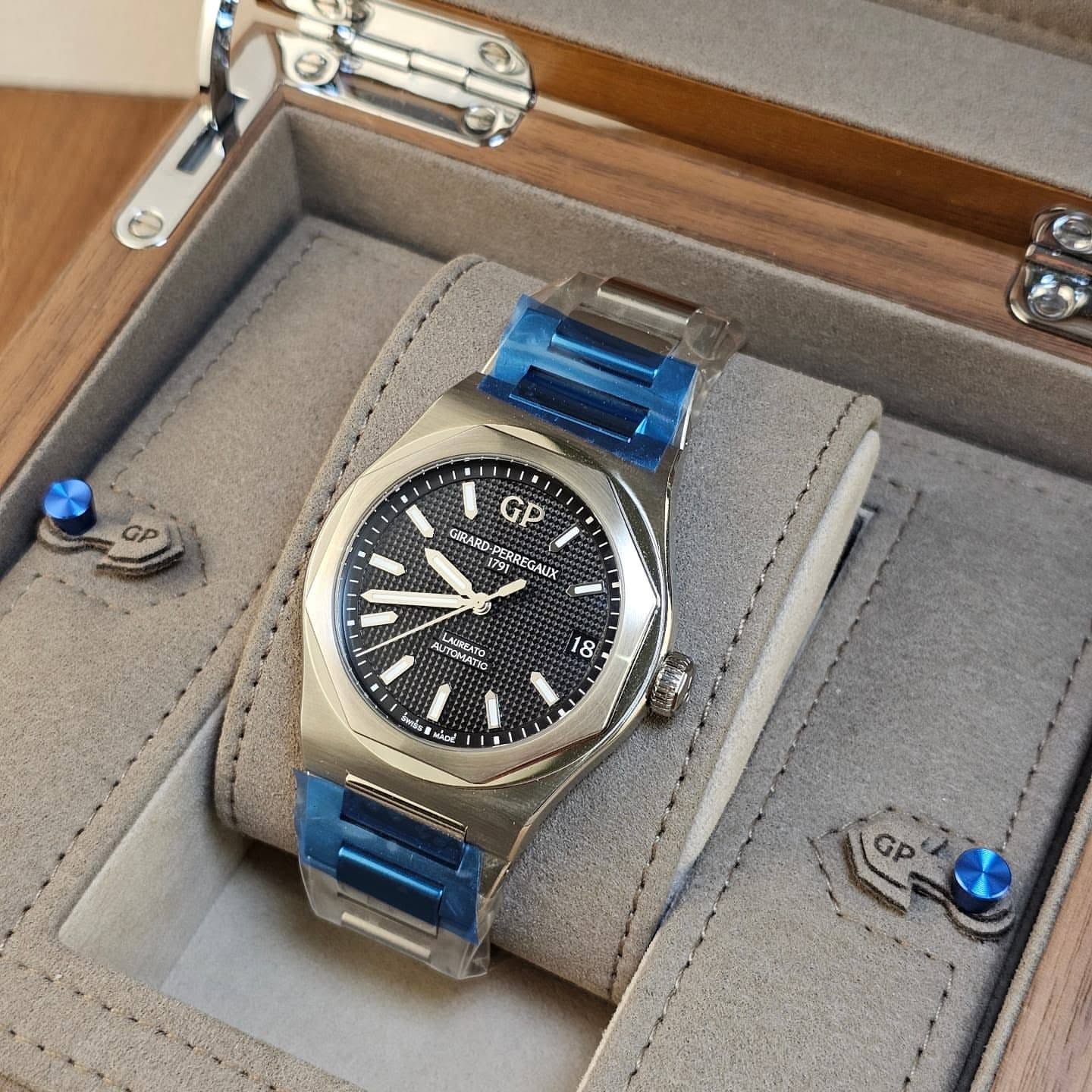 May be an image of wrist watch and text
