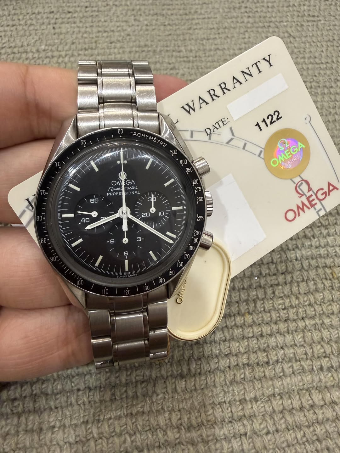 May be an image of wrist watch and text