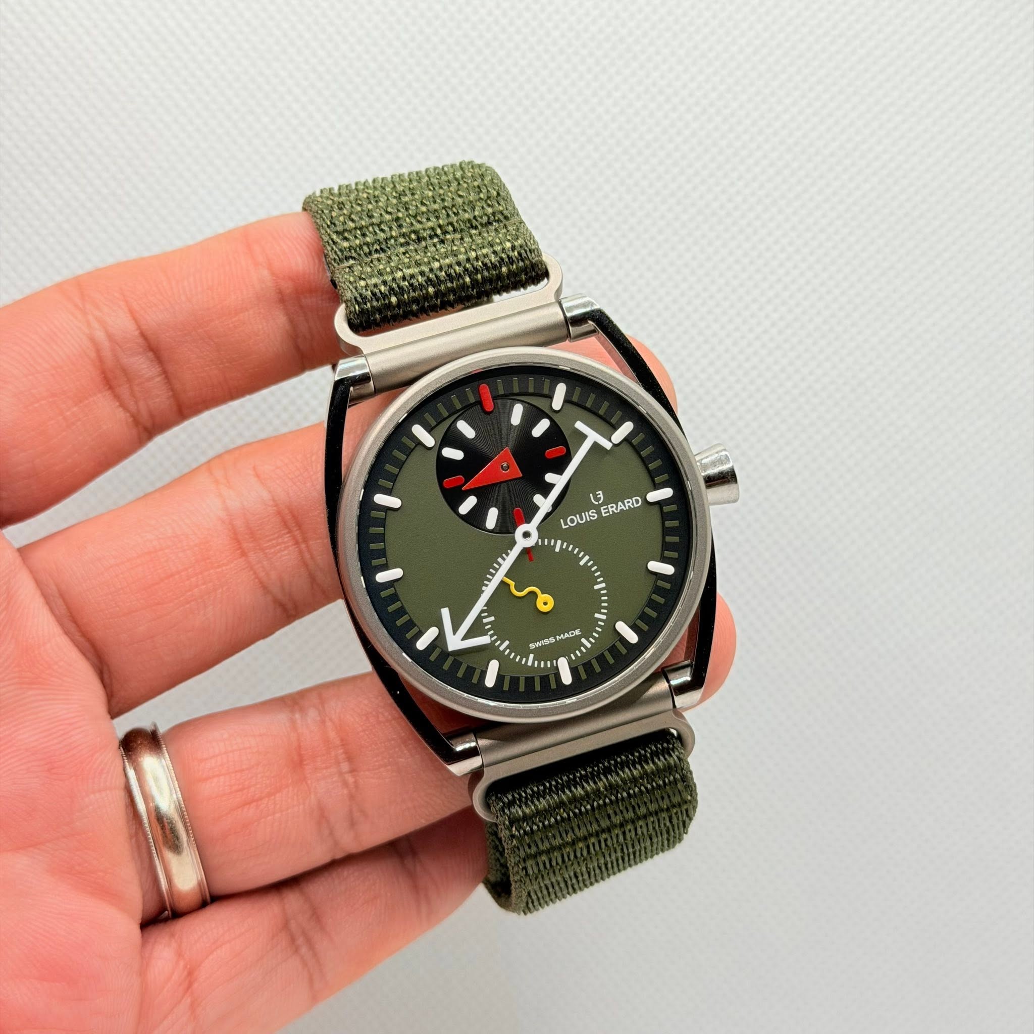 May be an image of wrist watch and text