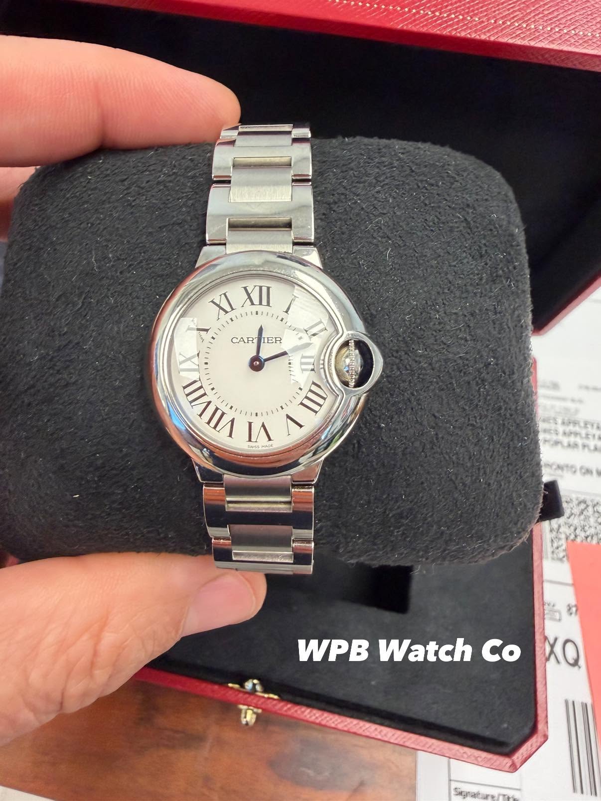 May be an image of wrist watch and text that says 'XI XIXII XII 11 I CAR CARTIER IER III VIIVIII VIII VI I ወ APPLEYA APPLET PLA (N1O Cn WPB Watch Co XQ'