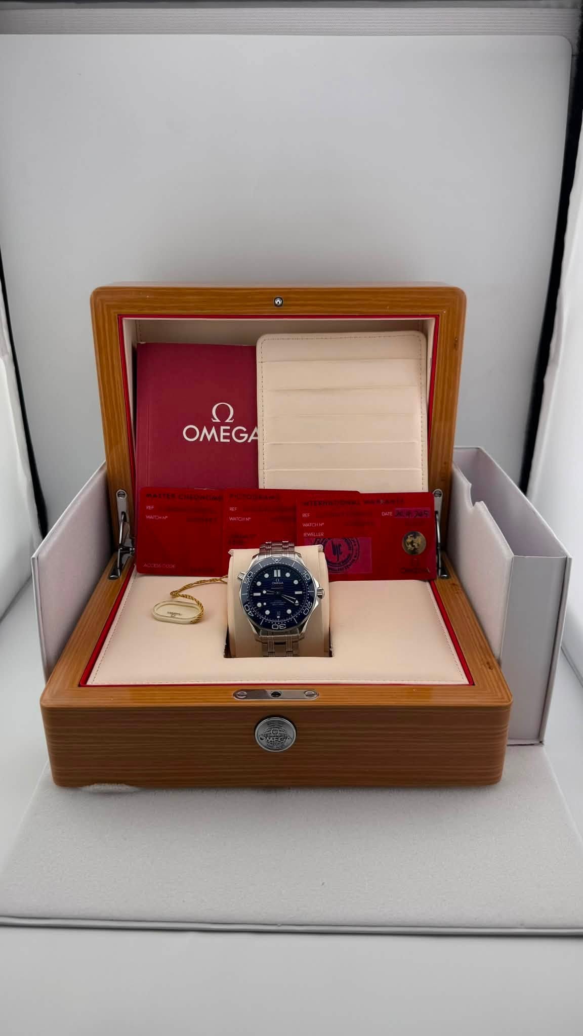 May be an image of wrist watch and text that says 'ח OMEGA'