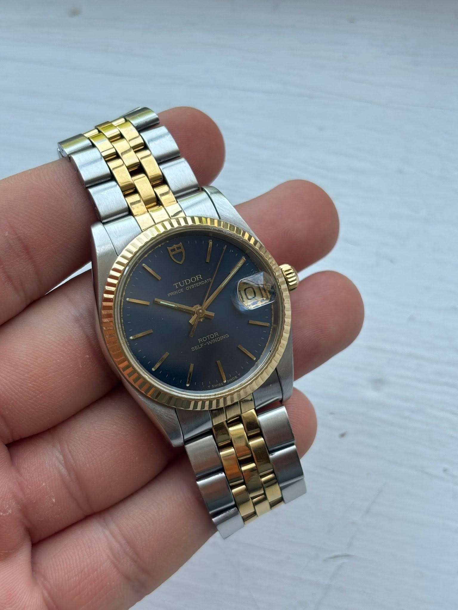 May be an image of wrist watch and text