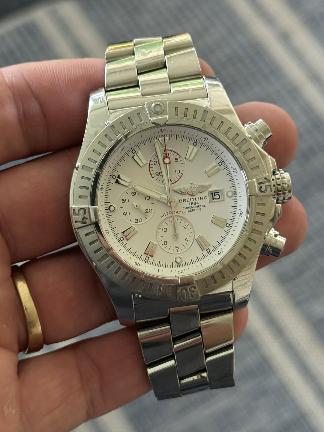 May be an image of wrist watch and text