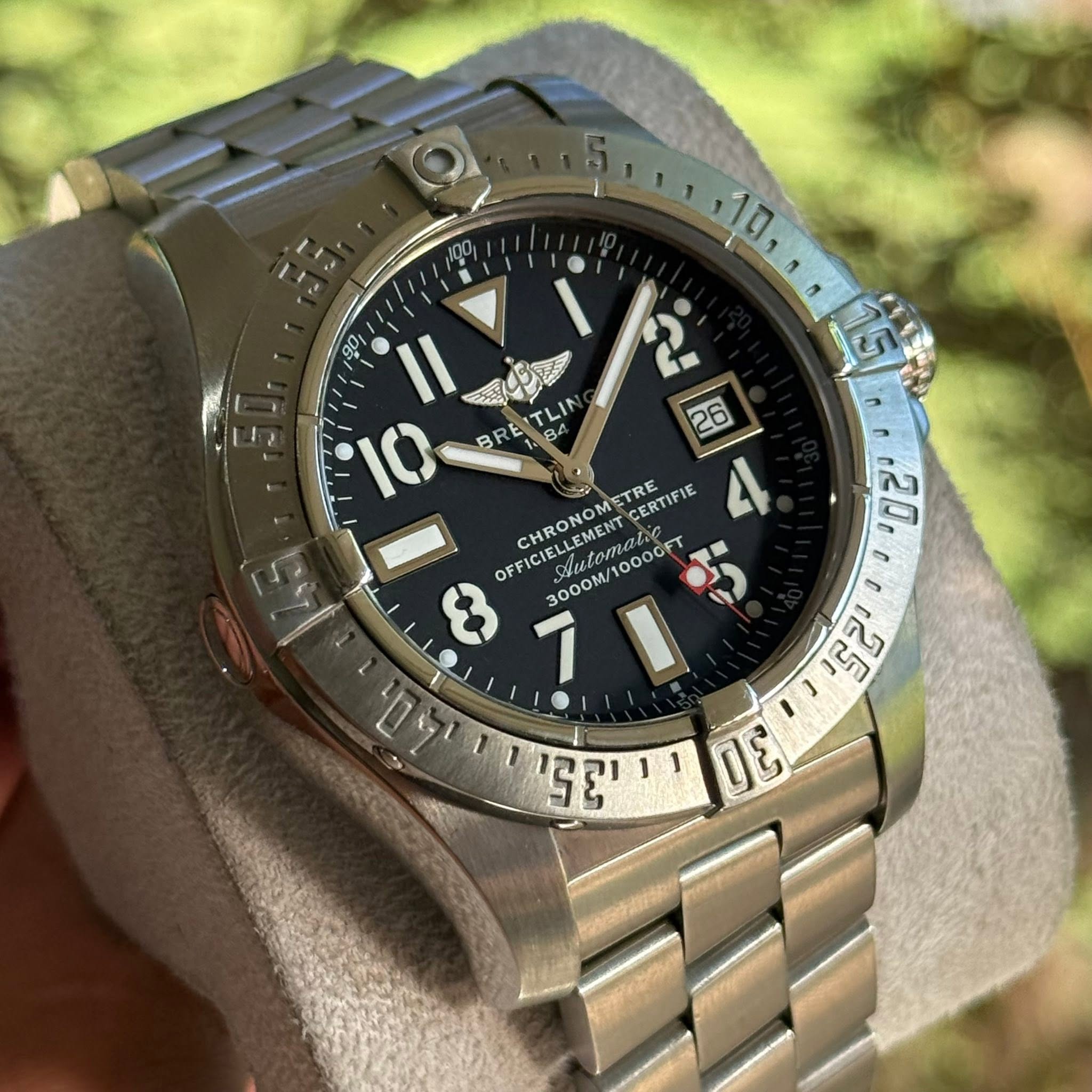 May be an image of wrist watch and text