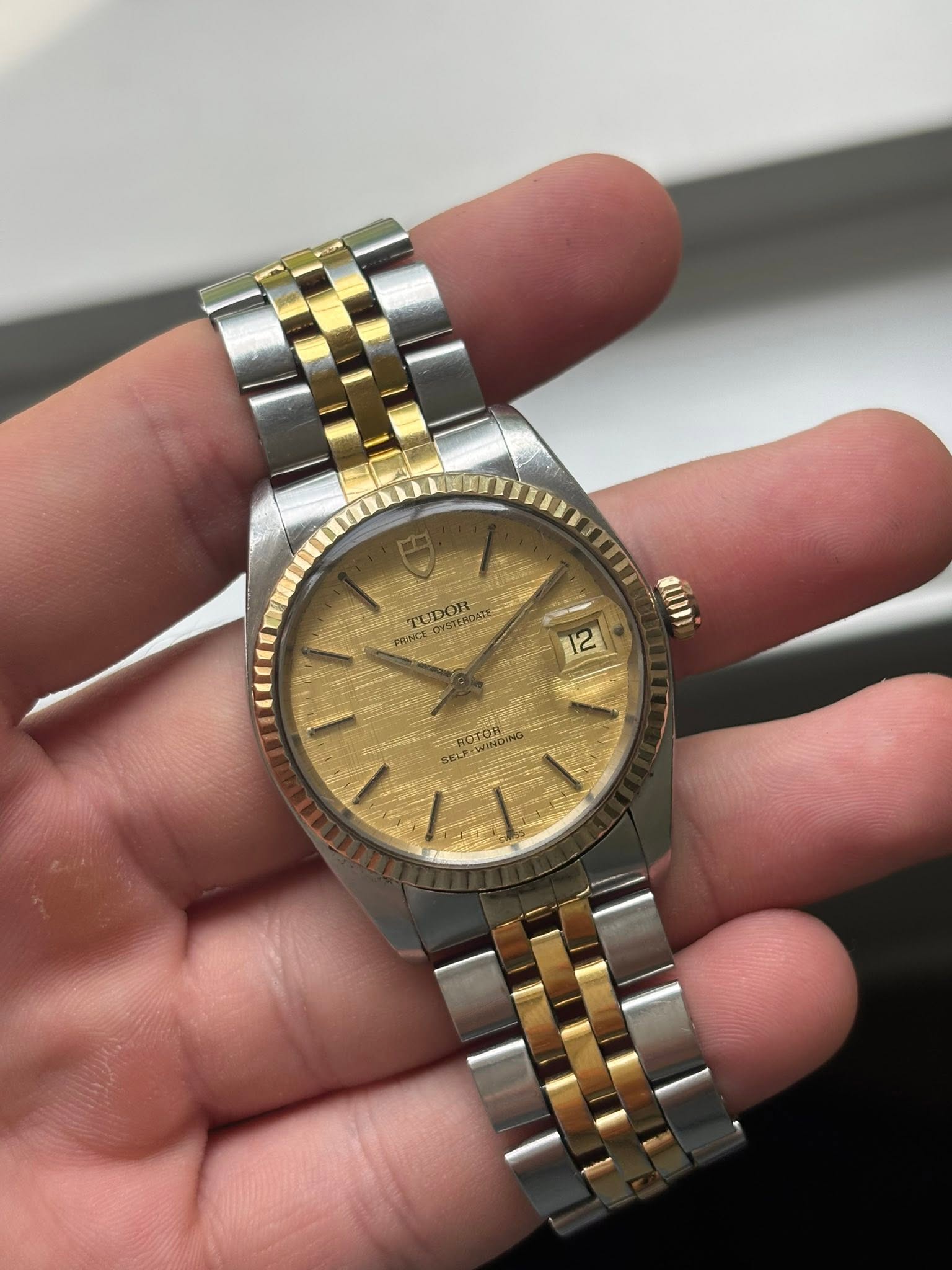 May be an image of wrist watch and text