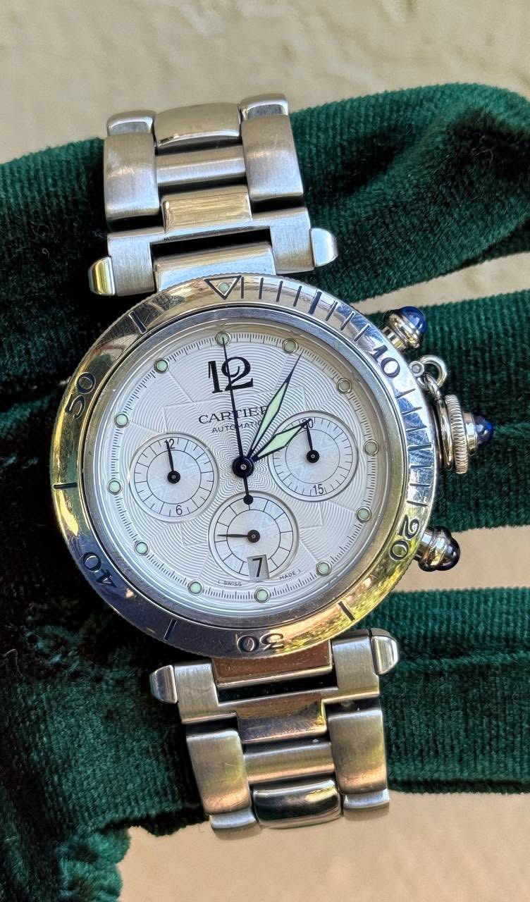 May be an image of wrist watch and text