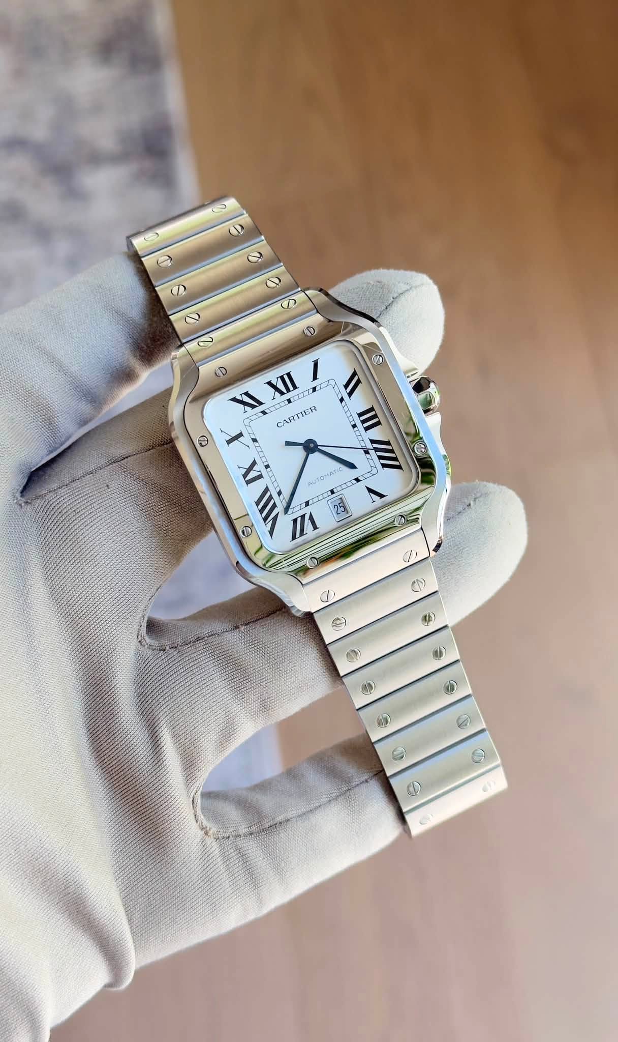 May be an image of digital watch and text that says 'D ٥ O D D D D ® D XI XII CARTIER ٥ III 他 IX e I 23 4 0 a, [ C 0) 0> 43 e E M ه eT'