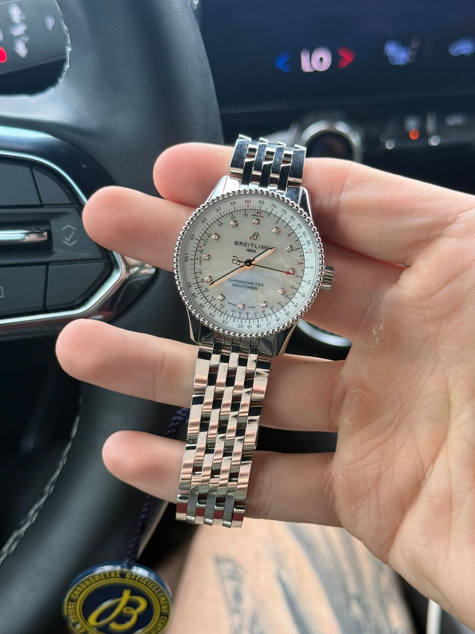 May be an image of wrist watch and text