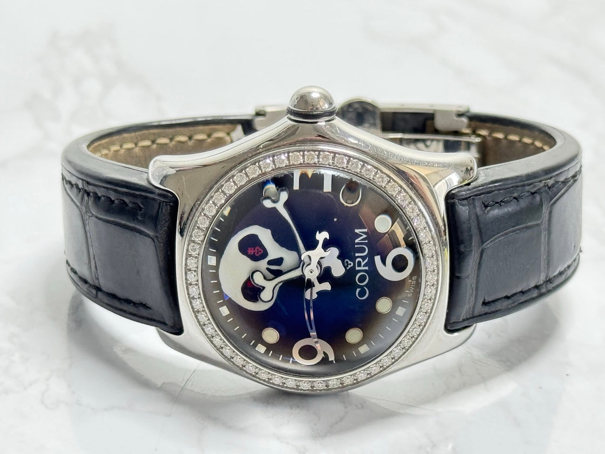 May be an image of wrist watch and text that says 'こお ነች CORUM 9 MS ರ'