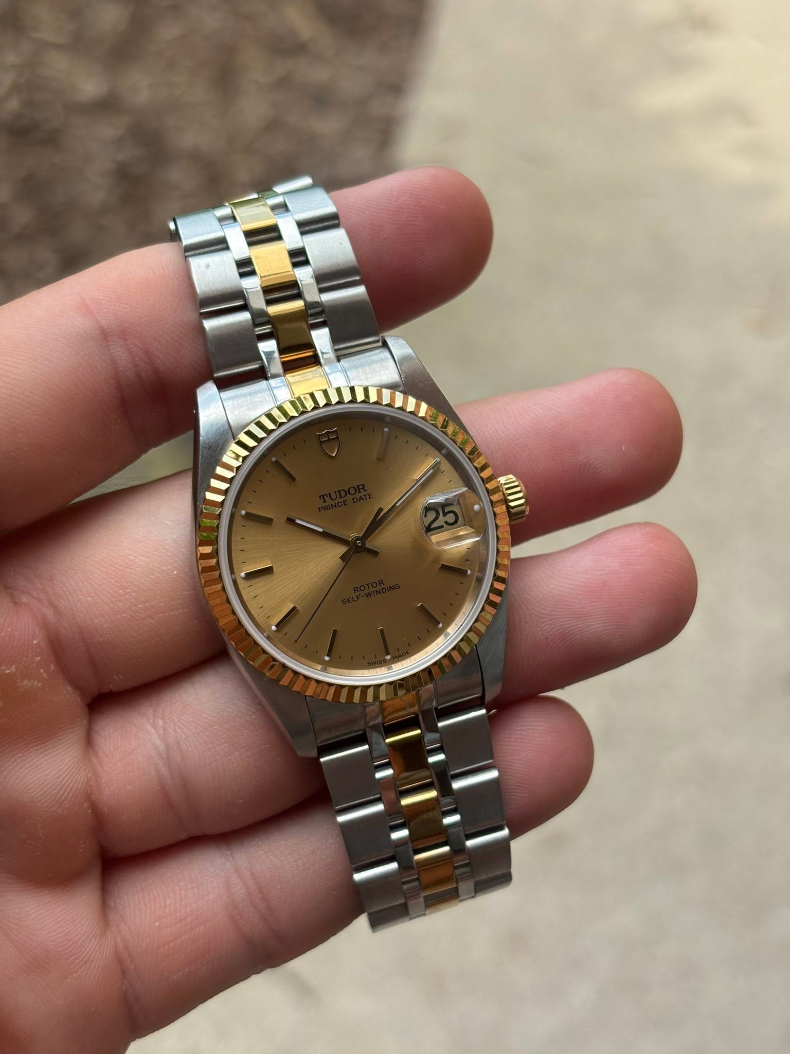 May be an image of wrist watch and text