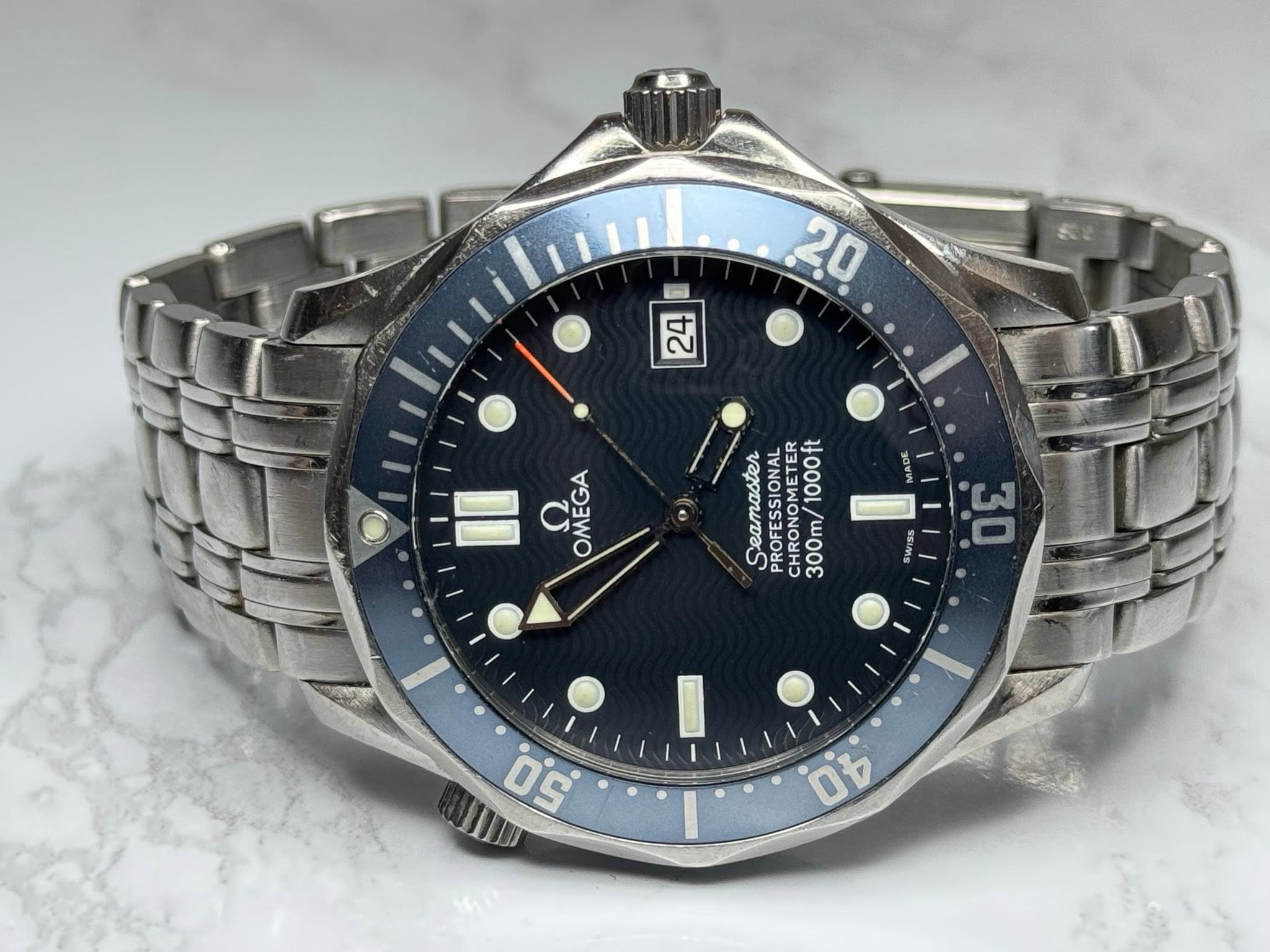 May be an image of wrist watch and text that says '20 24 24 OMEGA Seamaster PROFESSETE METER ET 1000f 300m/ 300m/1000ft PROONO CHRON '