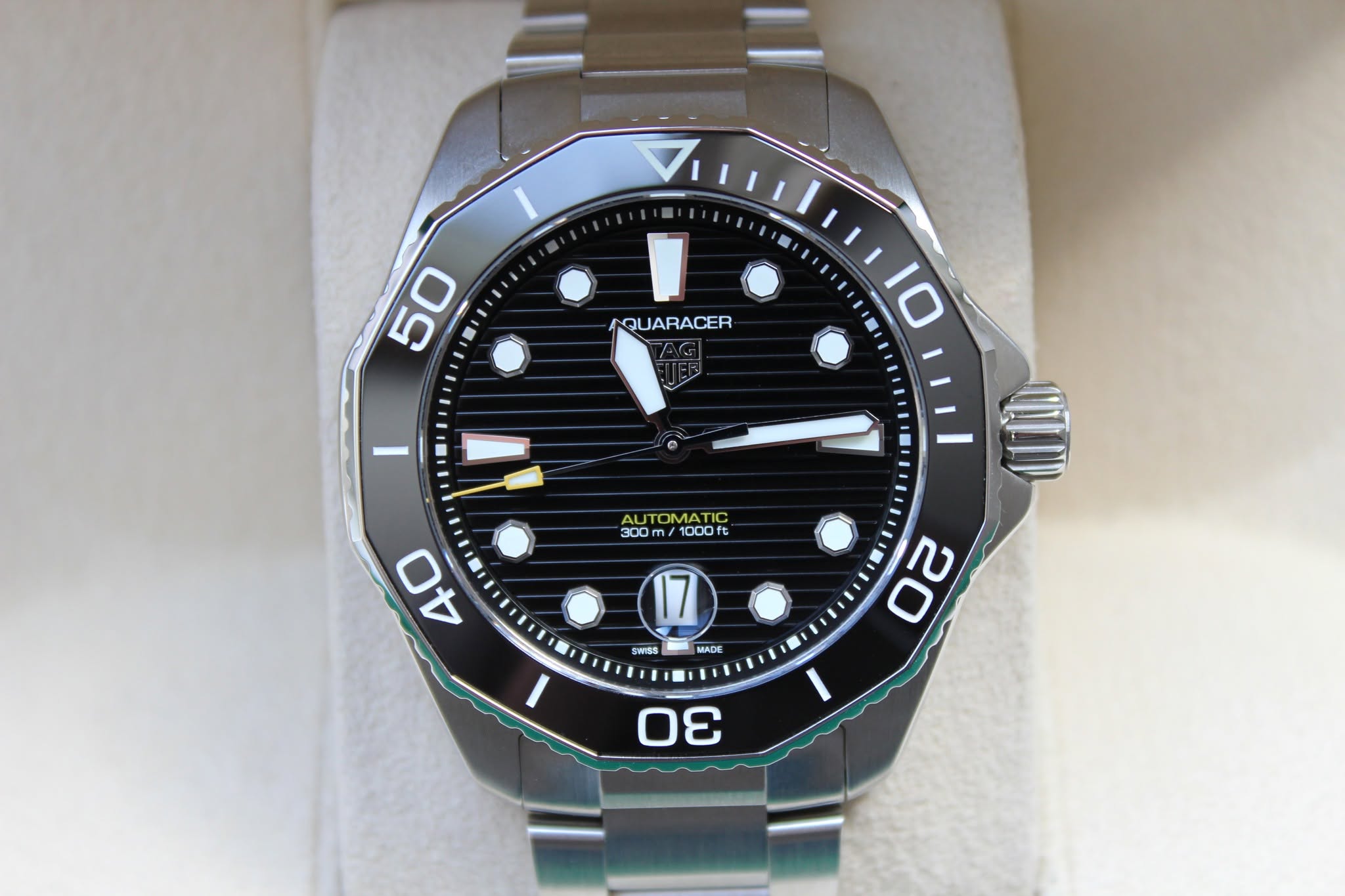 May be an image of wrist watch and text that says '50 AQUARACER 10 I AUTO AUTOMATIC 300 300m/1000ft m 1000ft 40 សិ 17 WISS MADE 20 -'