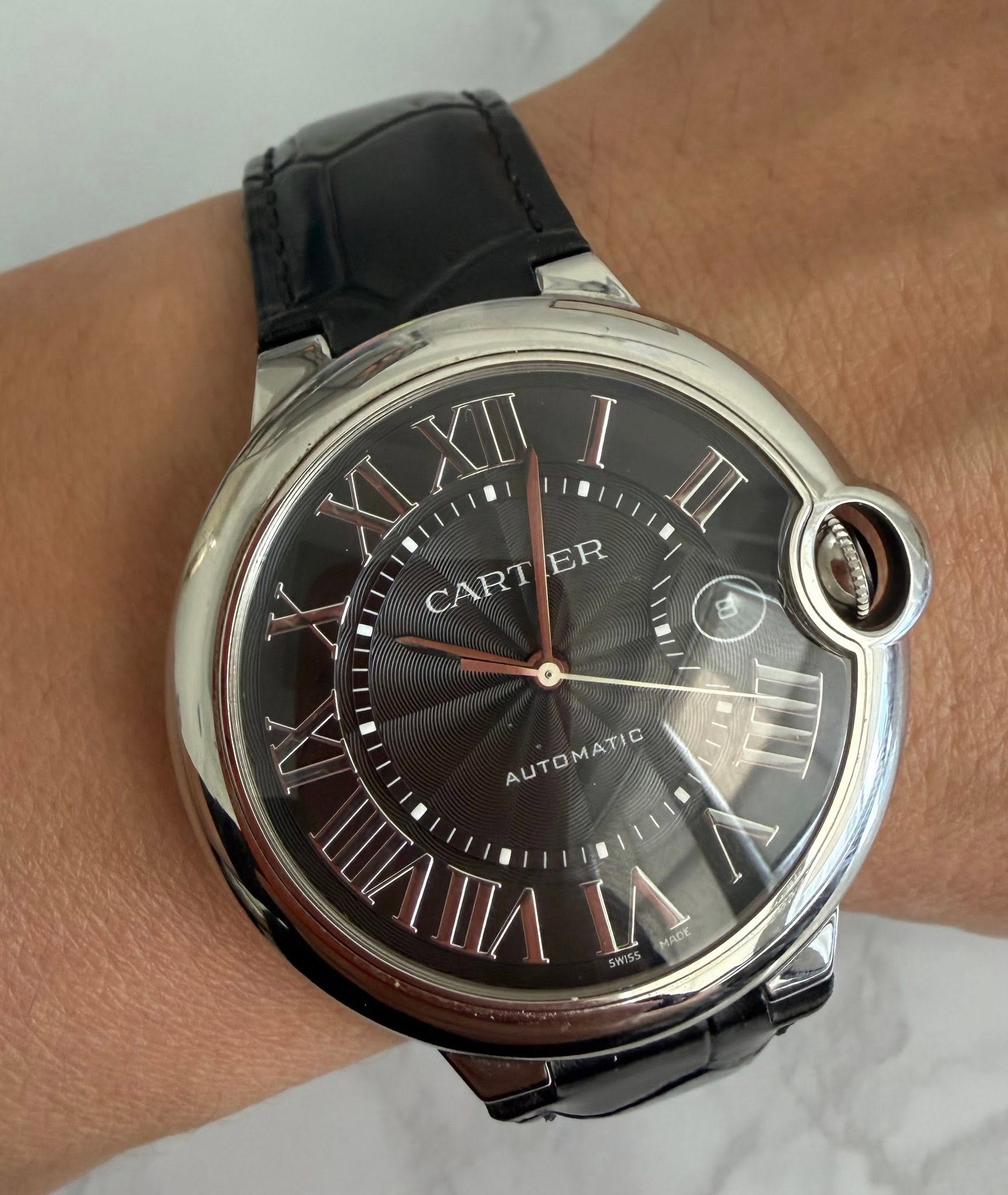 May be an image of wrist watch and text