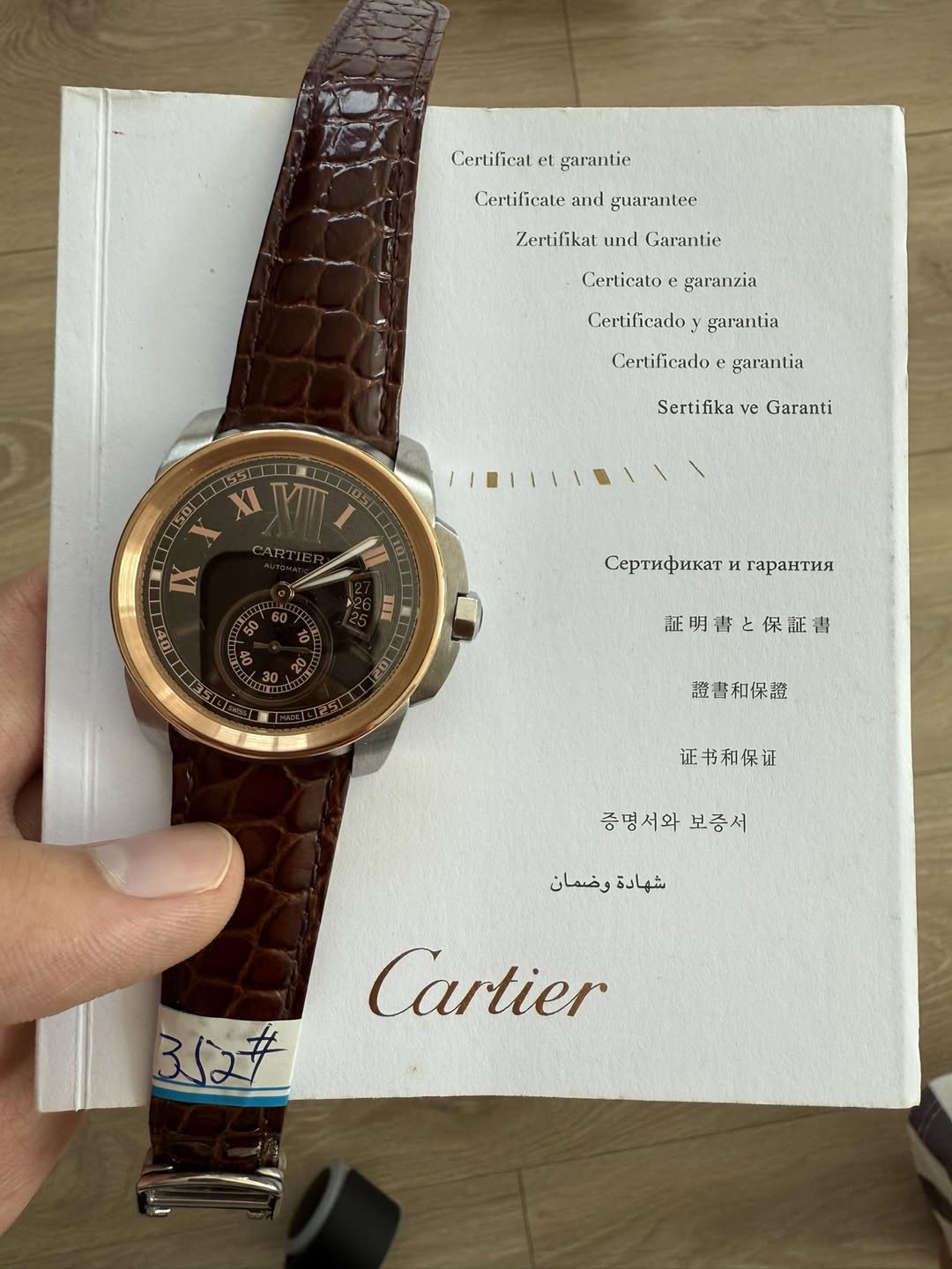 May be an image of wrist watch and text that says 'Certilicatetgarantie Certificat garantie Certificate Certificateandguarantee and guarantee س Zertifikat und Garantie Certicato…