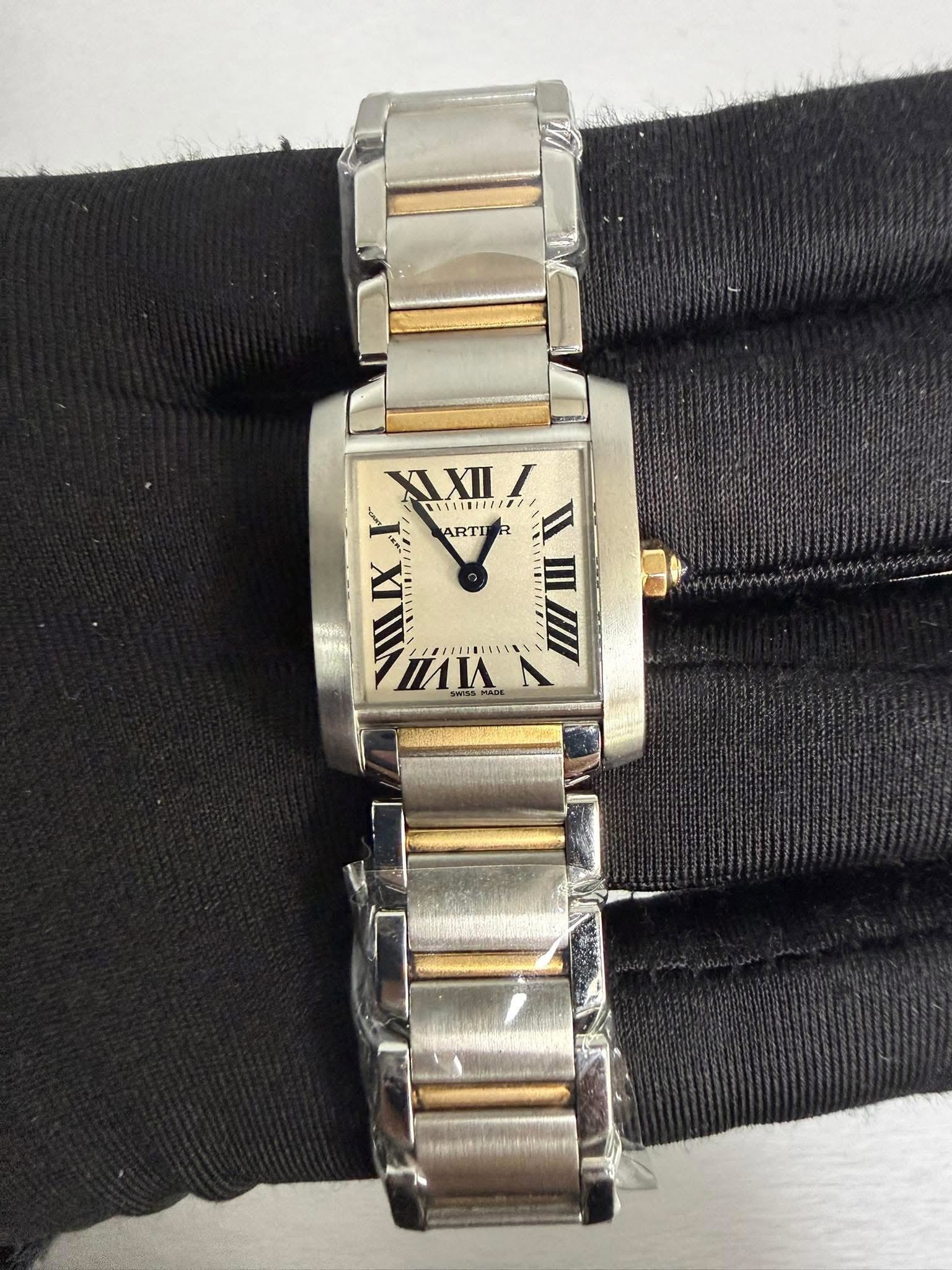 May be an image of wrist watch and text