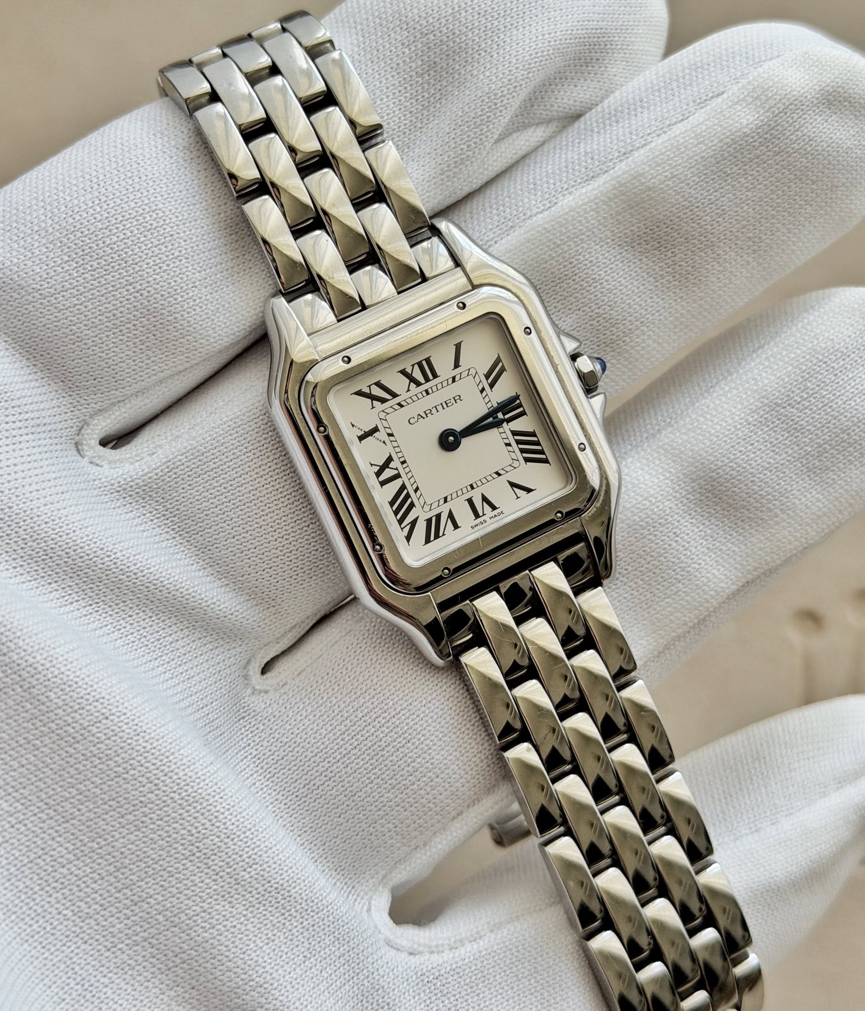 May be an image of wrist watch and text