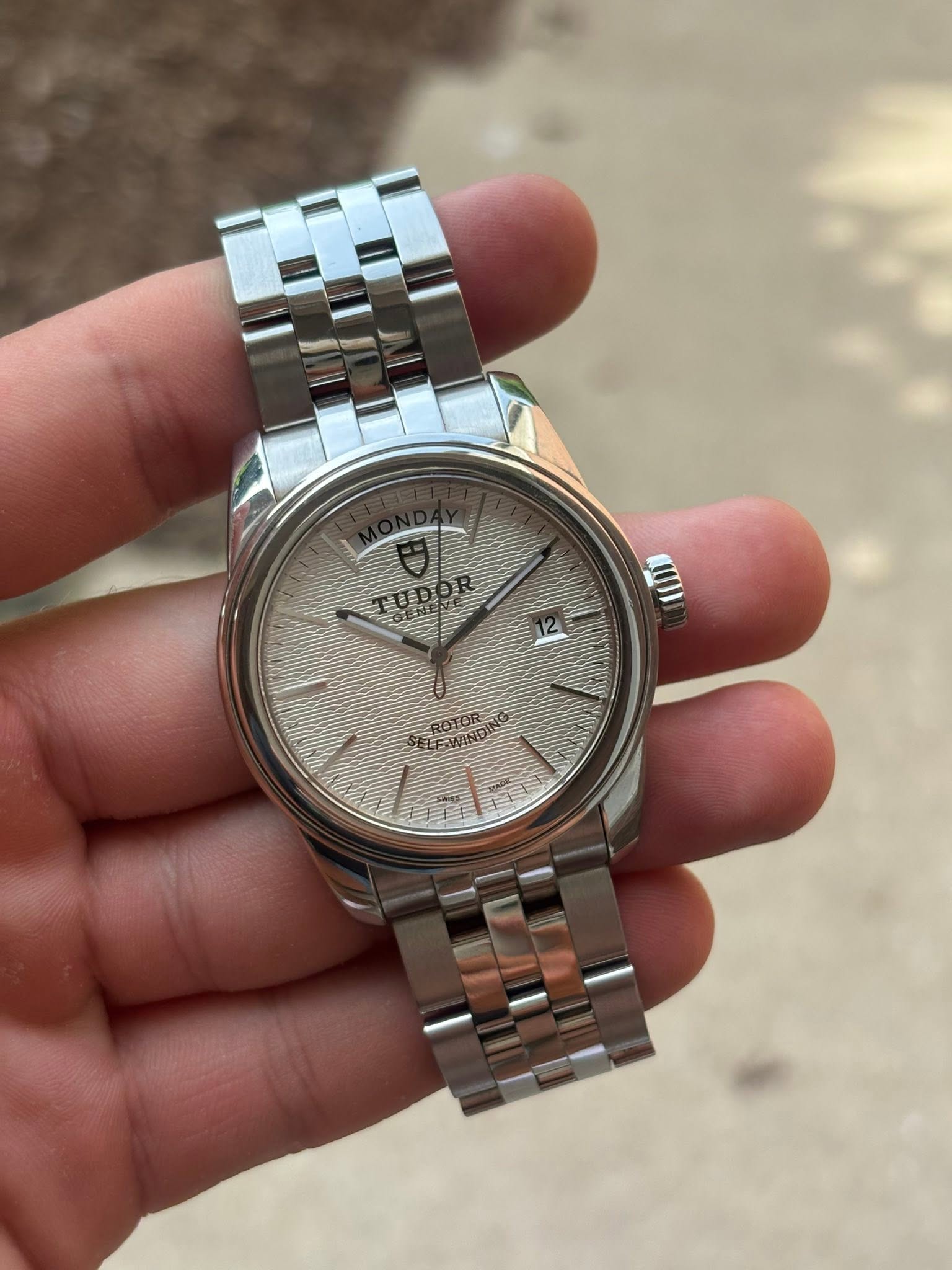 May be an image of wrist watch and text