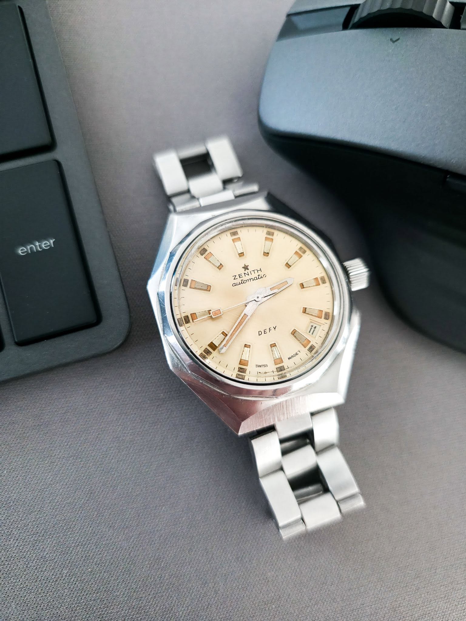 May be an image of wrist watch and text