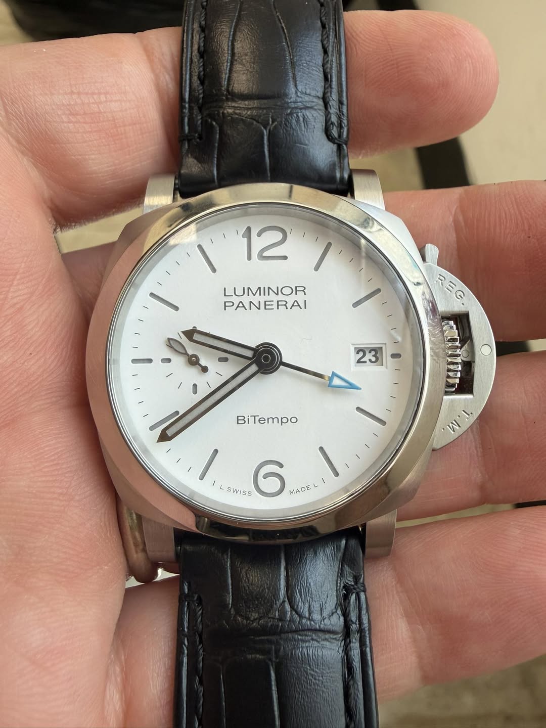 May be an image of wrist watch and text