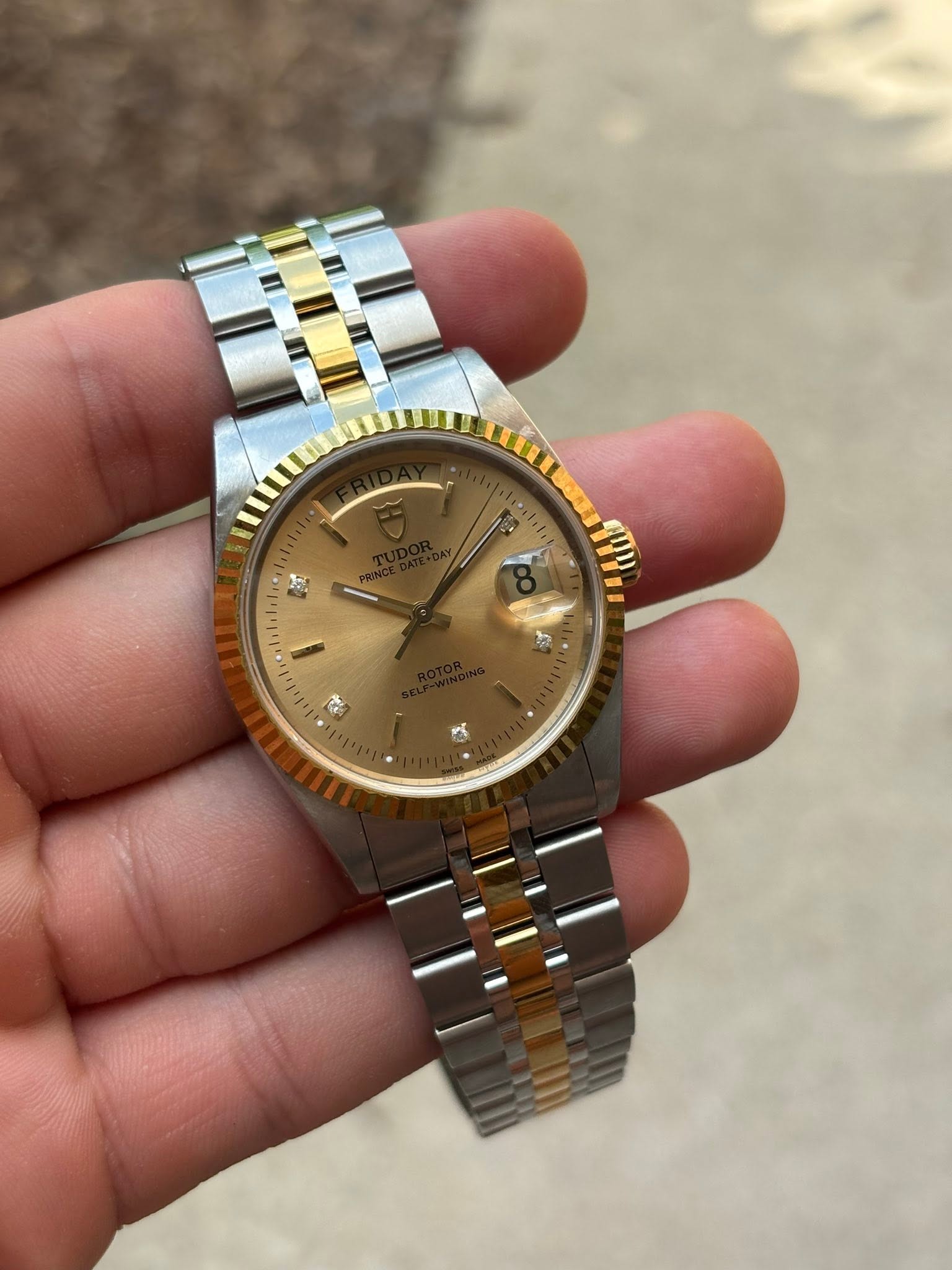 May be an image of wrist watch and text