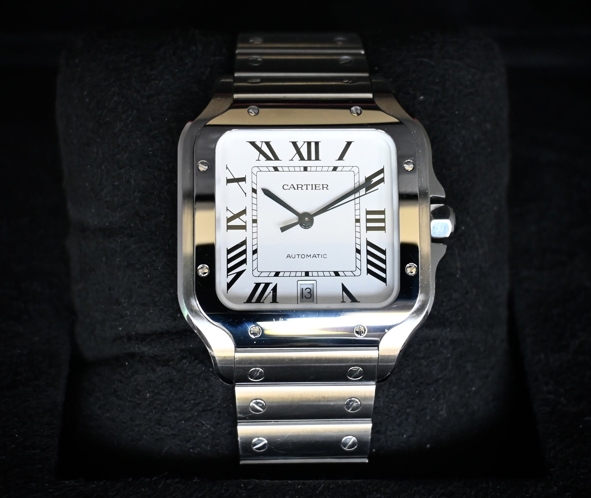 May be an image of digital watch and text that says 'XI XIXIII I XII ن CARTIER 4 三 AUTOMATIC O4A MATIC Au 0 EEDN 一 3 海'