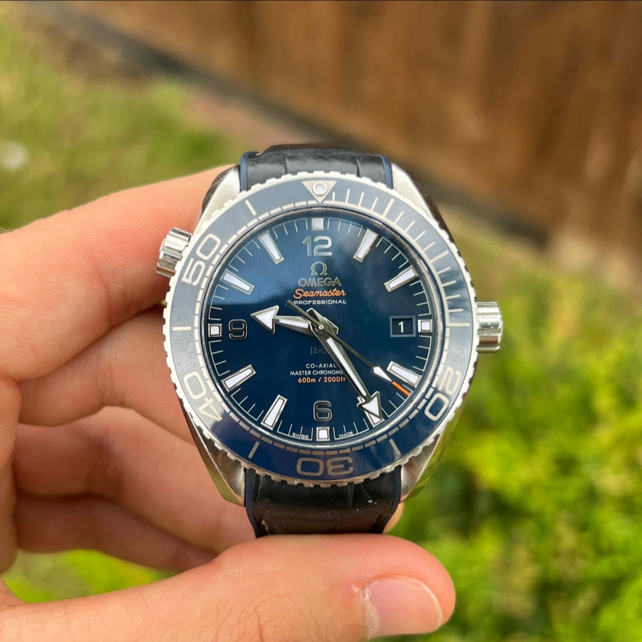May be an image of wrist watch and text