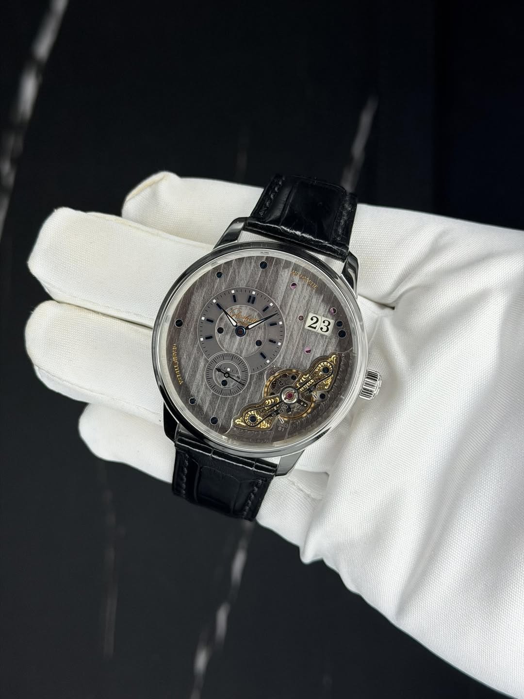 May be an image of wrist watch and text