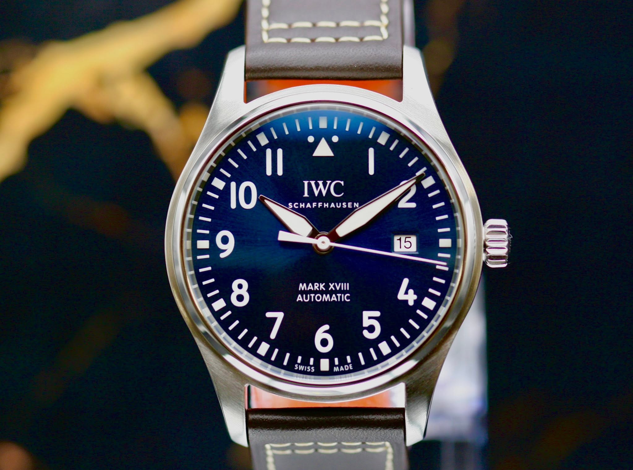 May be an image of wrist watch and text that says 'Il 10 IWC SCHAFFHAUSEN L 9 15 ጠሀ 8 MARK XVIII AUTOMATIC 4 7 5 6 SWISS MADE'