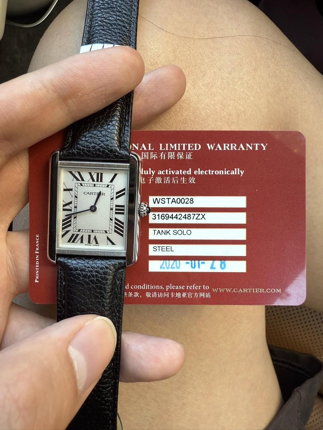 May be an image of digital watch and text that says 'XII INAL NALLIMITED LIMITED WARRANTY 国际有限保证 luly activated electronically 子激活后生效 CARTI WSTA0028 3169442487ZX THA MAJAN 1Z…
