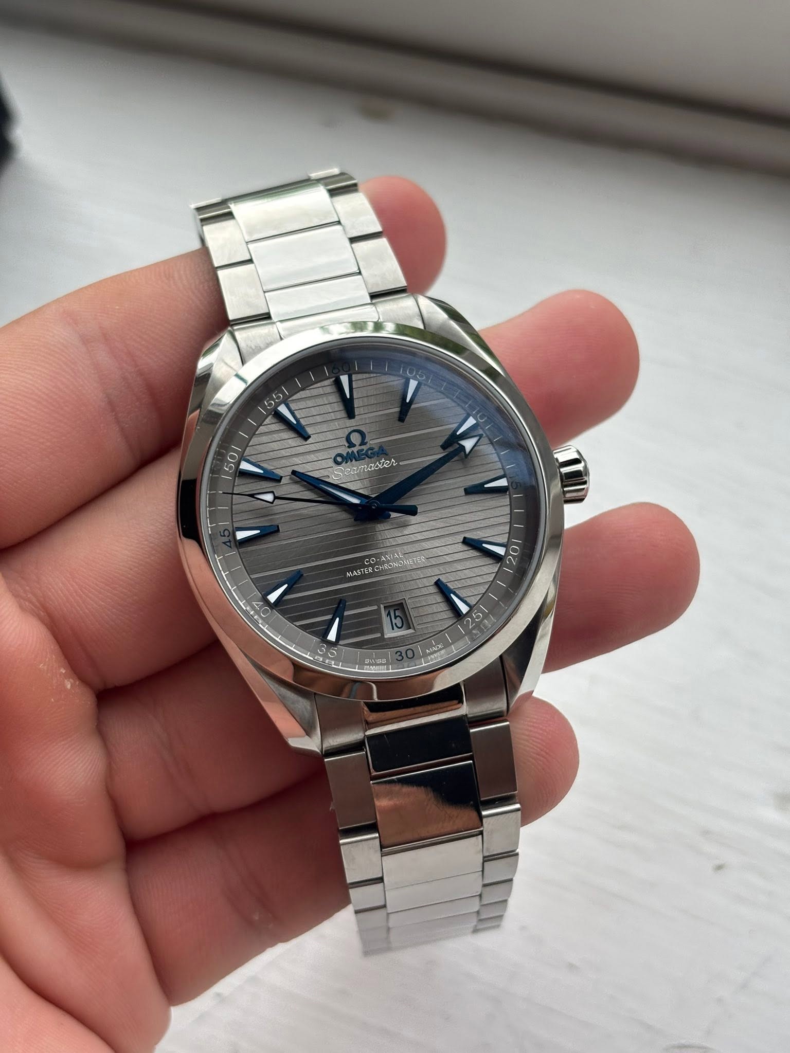 May be an image of wrist watch and text