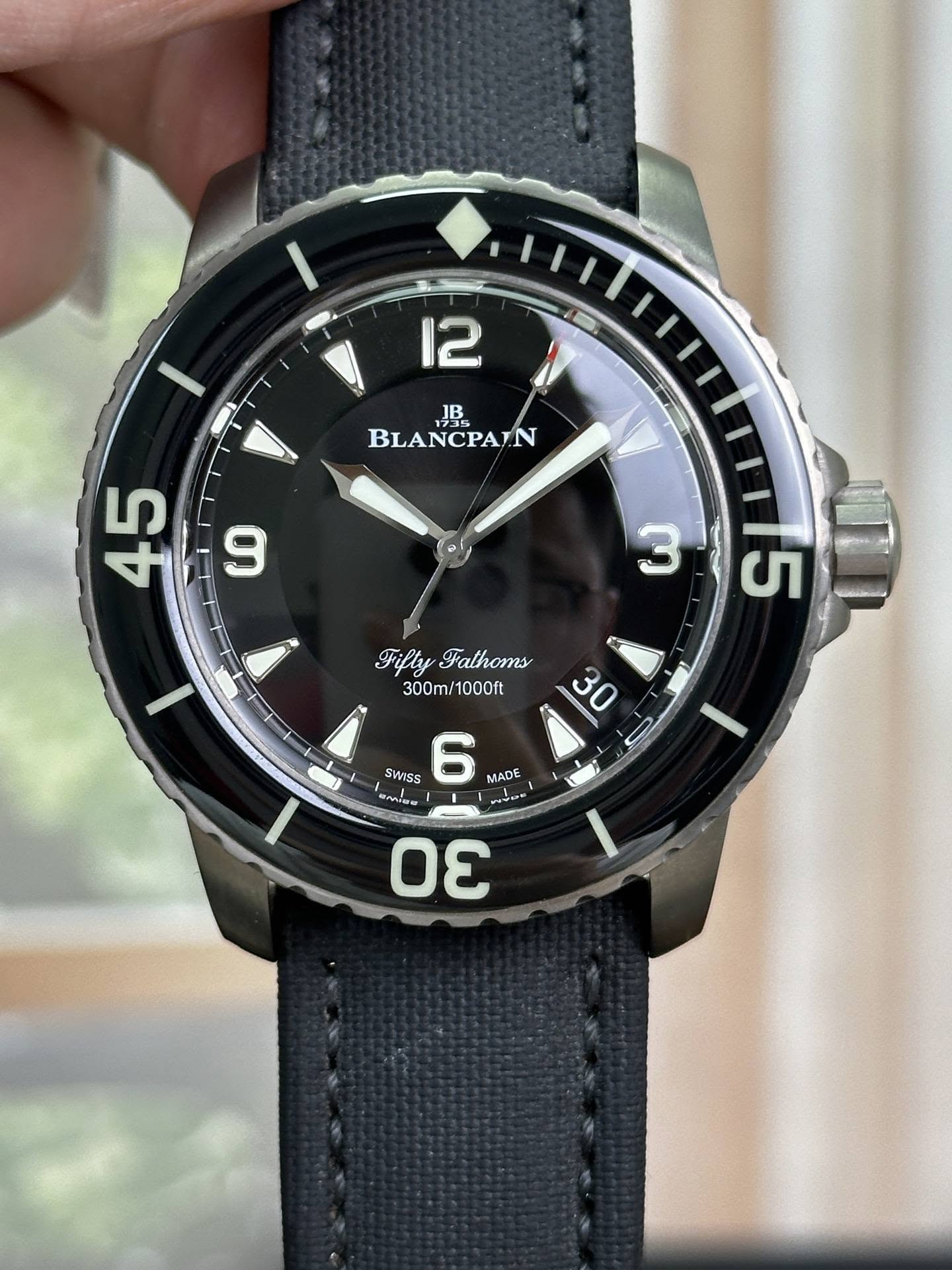 May be an image of wrist watch and text that says '12 BLANCPAN BLAN 1735 45 LO 3 5 y FiflyFathoms Fathoms 300m/1000ft 30 3 SWISS 6 MADE လာ ia うん5 k L 1 Οε D'