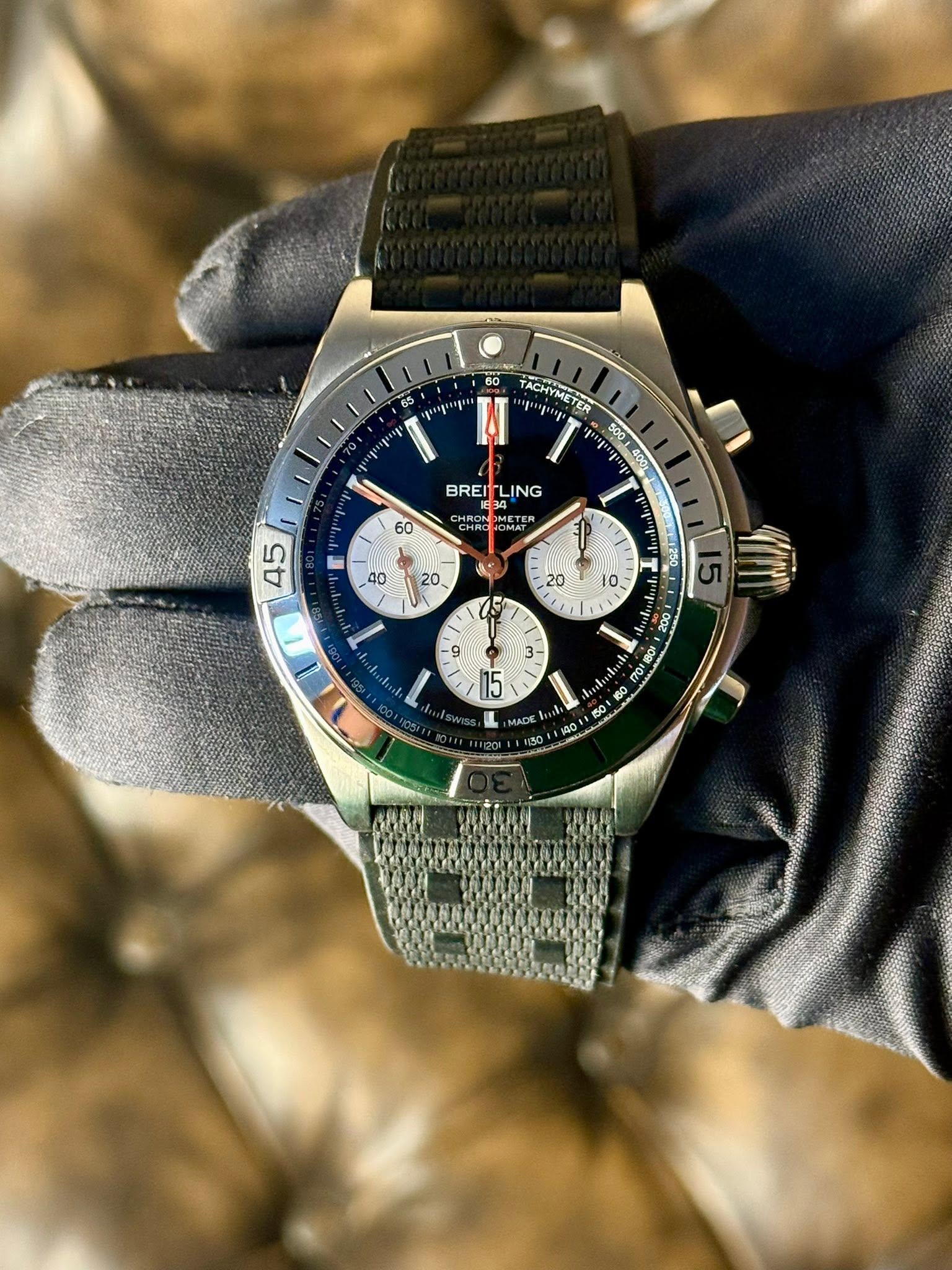 May be an image of wrist watch and text that says '60 TACHN CHYMETER .កកុរ TER ACHYMETER 5001400% BREI ING -34 OMAT 60 P n oo0 OOZ 2 1BOK O 100 15 MADE 140 40'