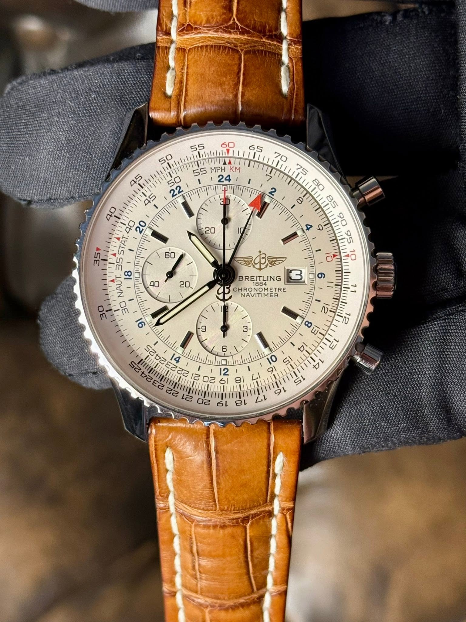 May be an image of wrist watch and text that says '50 55 بblelellI Welealelaf 65 70 ATU KM 45 50 55 2E υημηη 4 TAT 20 35Y 60 95 AO 20 8 8 NAUT BREITLING HRONOMETRE NAVITIMER…