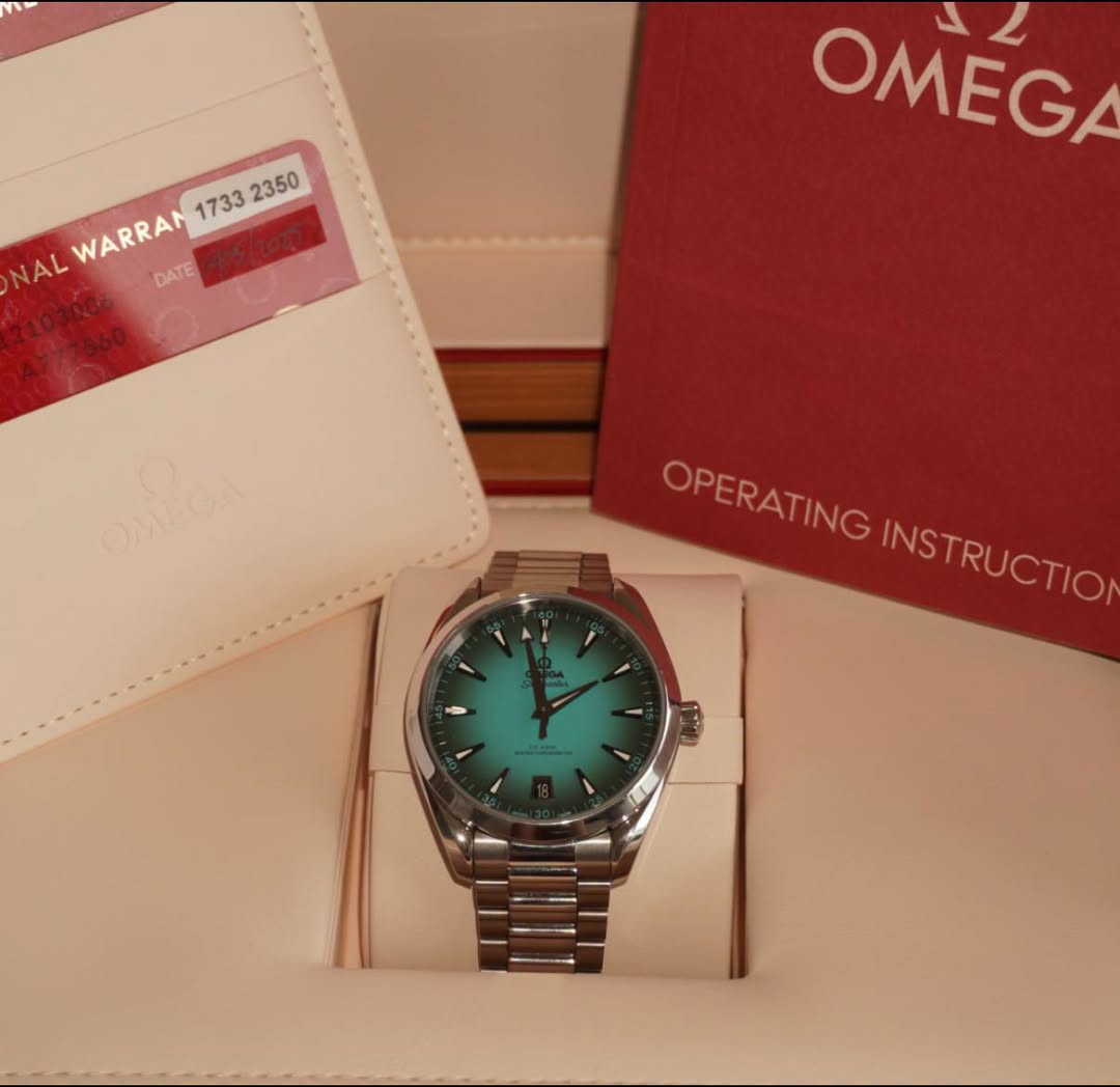 May be an image of wrist watch and text that says '12 OMEGA WARRAN NAL DATE 210300 A777560 2700 n OPERATING OPERATING INSTRUCTION INSTRUCTIO'