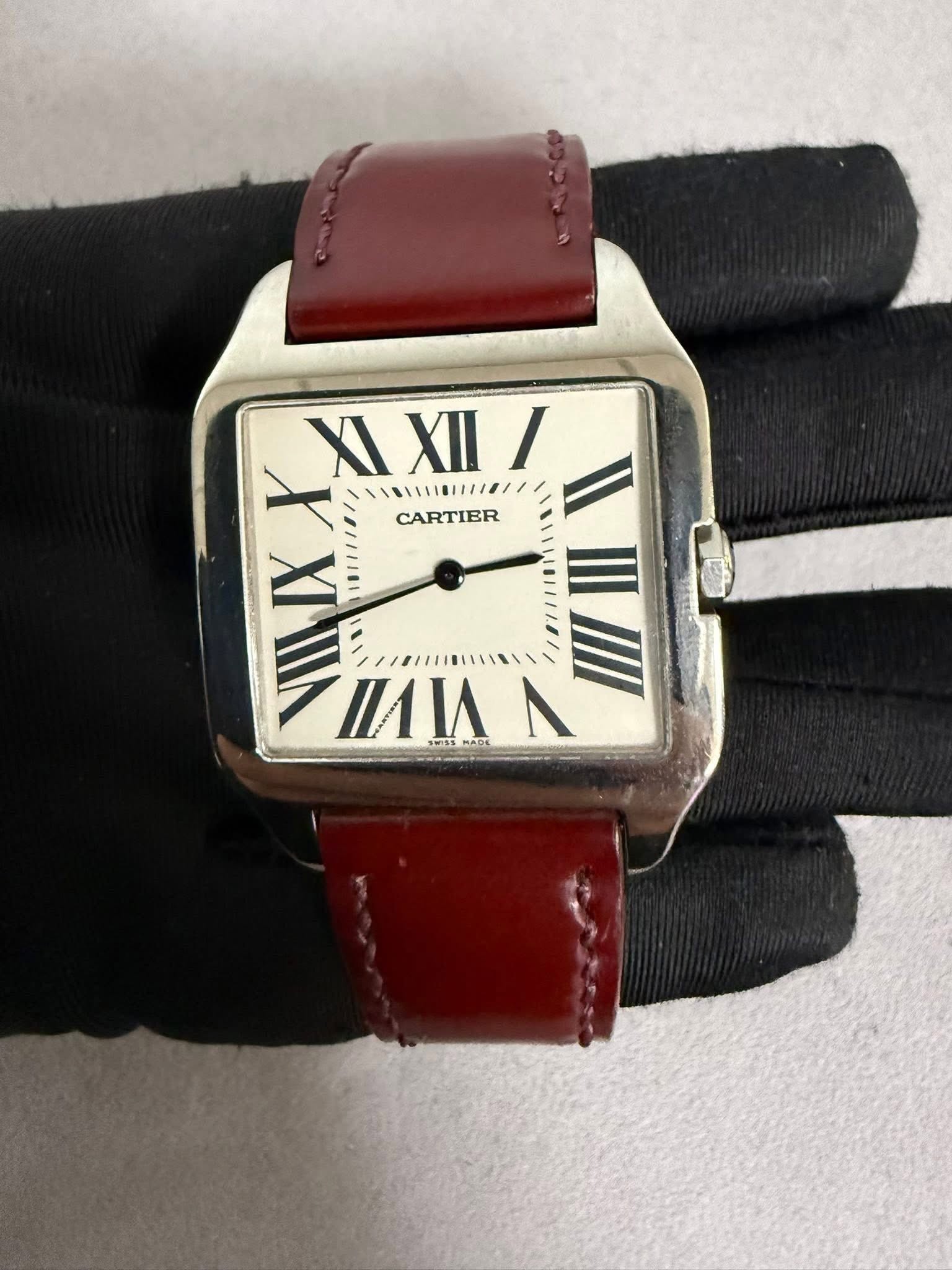 May be an image of wrist watch and text