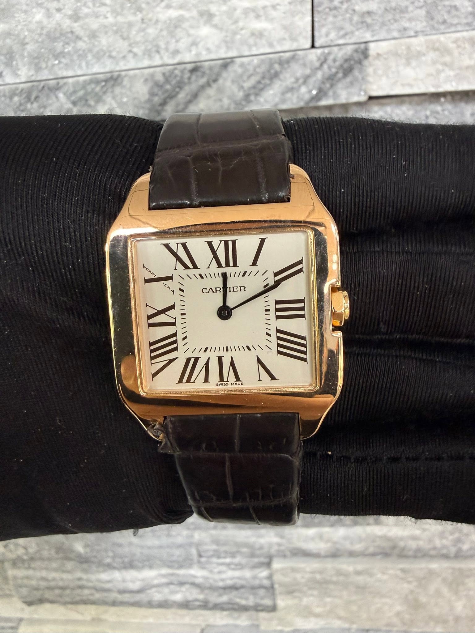 May be an image of wrist watch and text