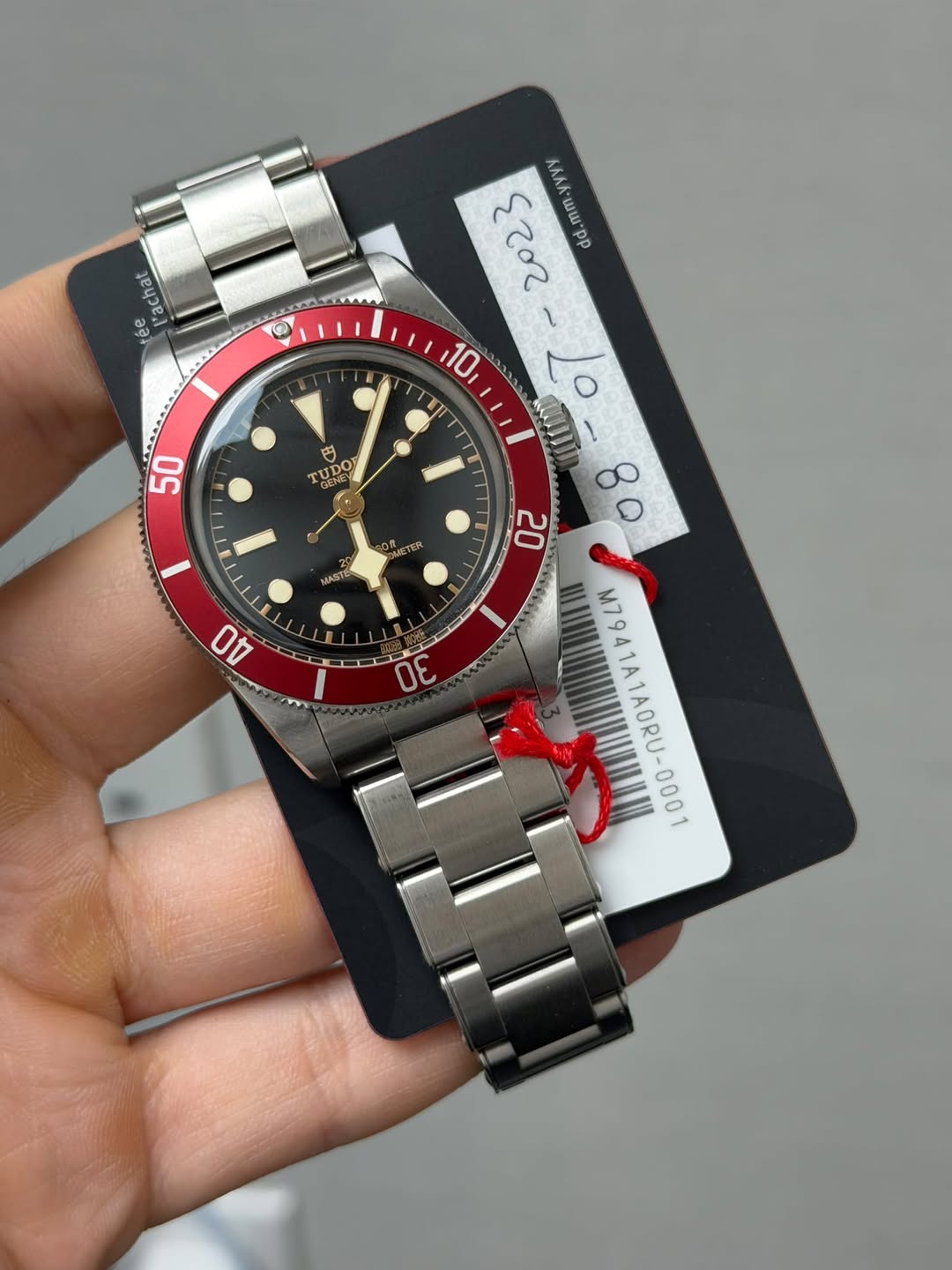 May be an image of wrist watch and text