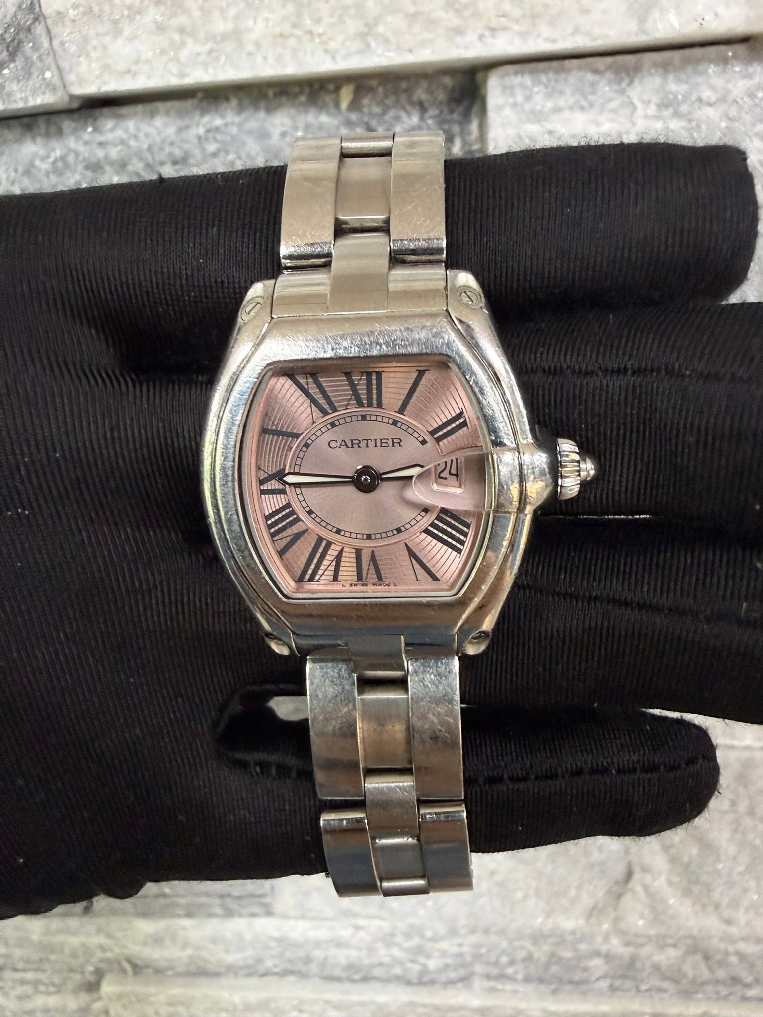 May be an image of wrist watch and text