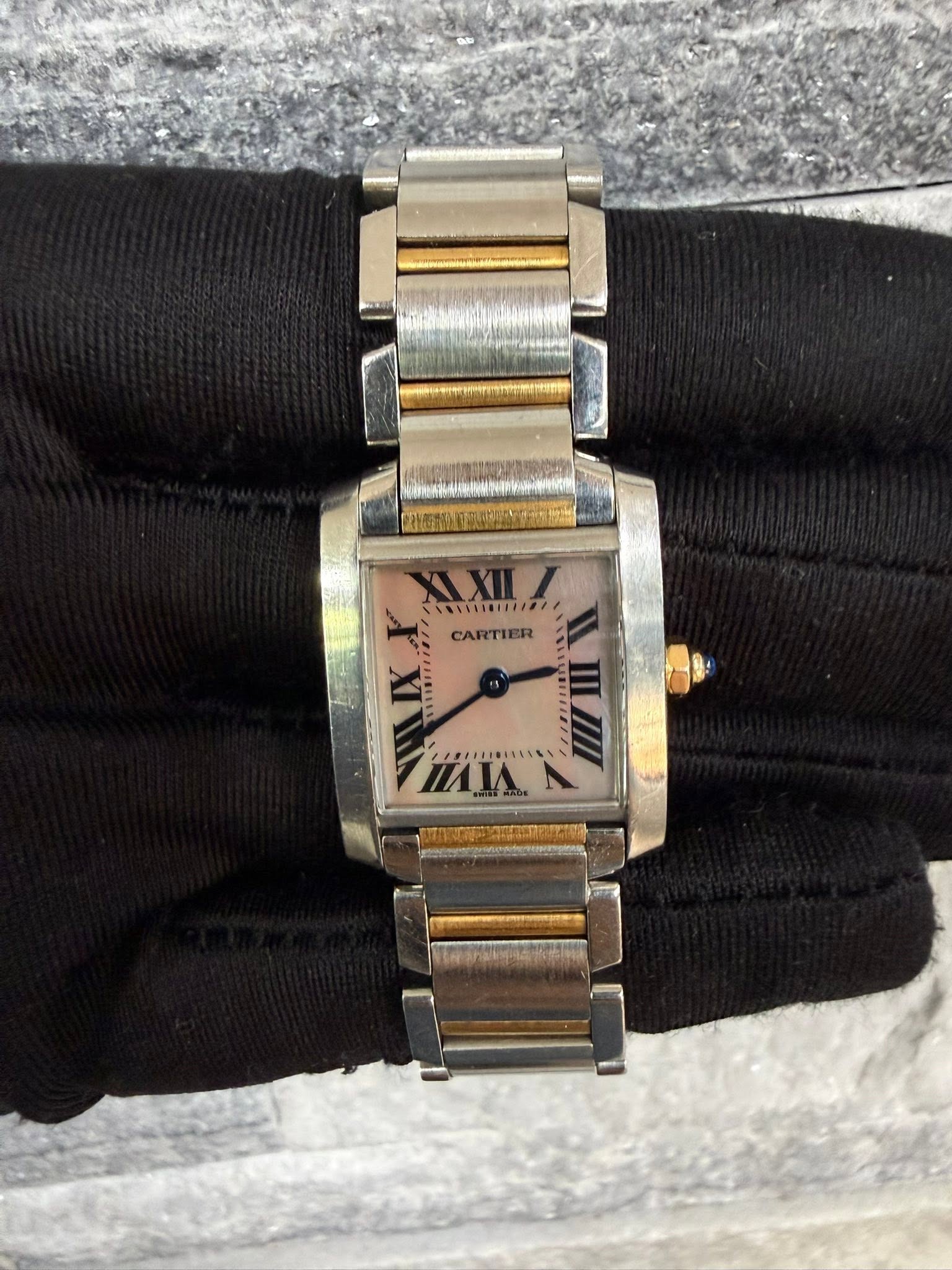 May be an image of wrist watch and text
