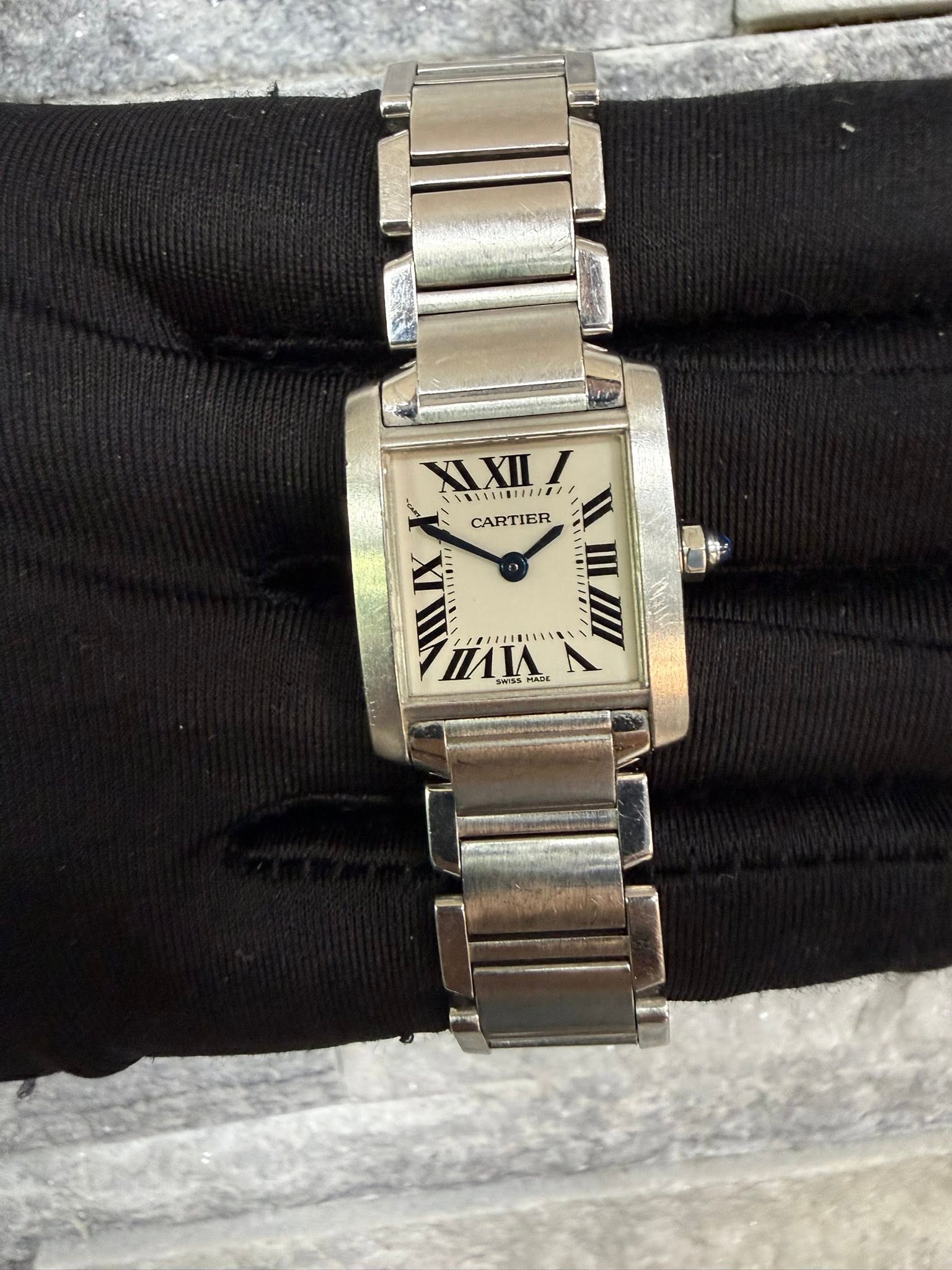 May be an image of wrist watch and text
