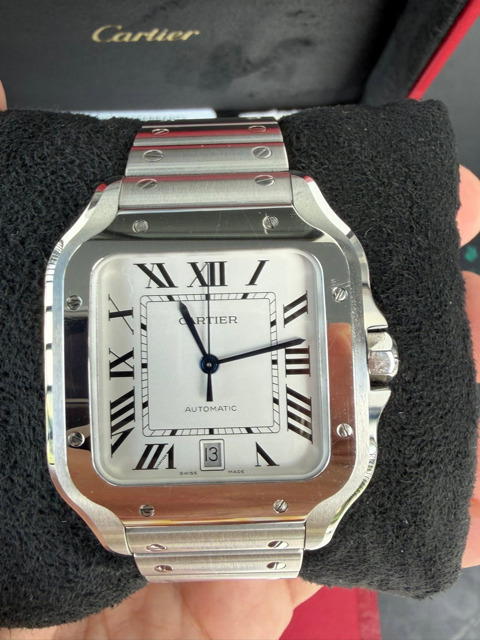 May be an image of wrist watch and text