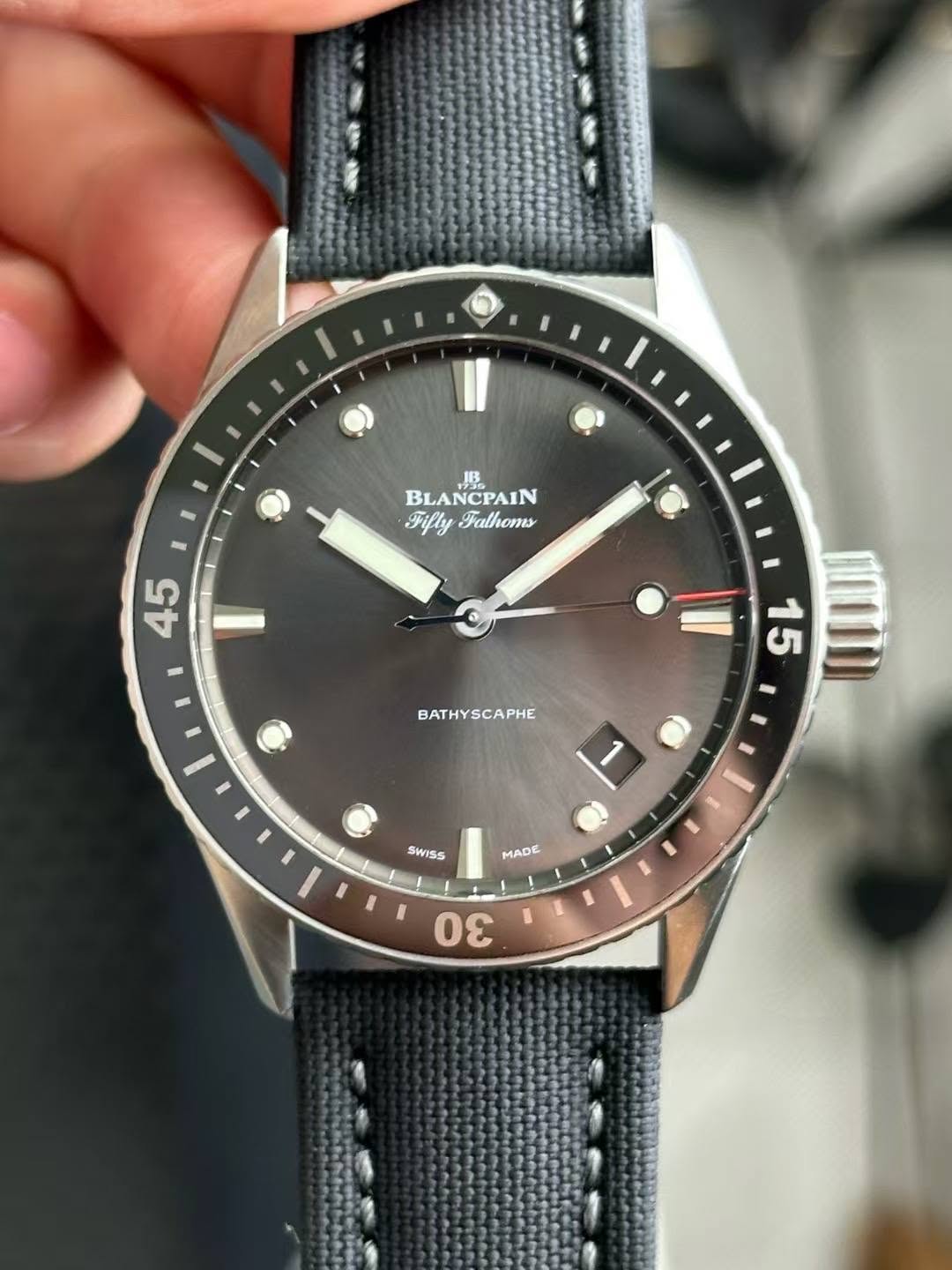 May be an image of wrist watch and text that says '1 BLA BLANCPAIN Fifly FiflyFalhoms Falhoms 10 45 BATHYSCAPHE 15 SWISS MADE I 30'
