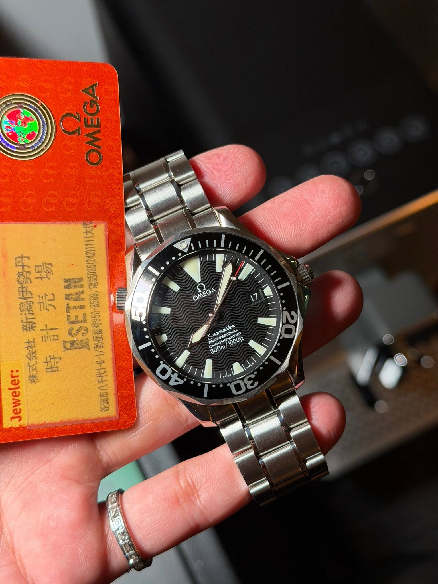 May be an image of wrist watch and text