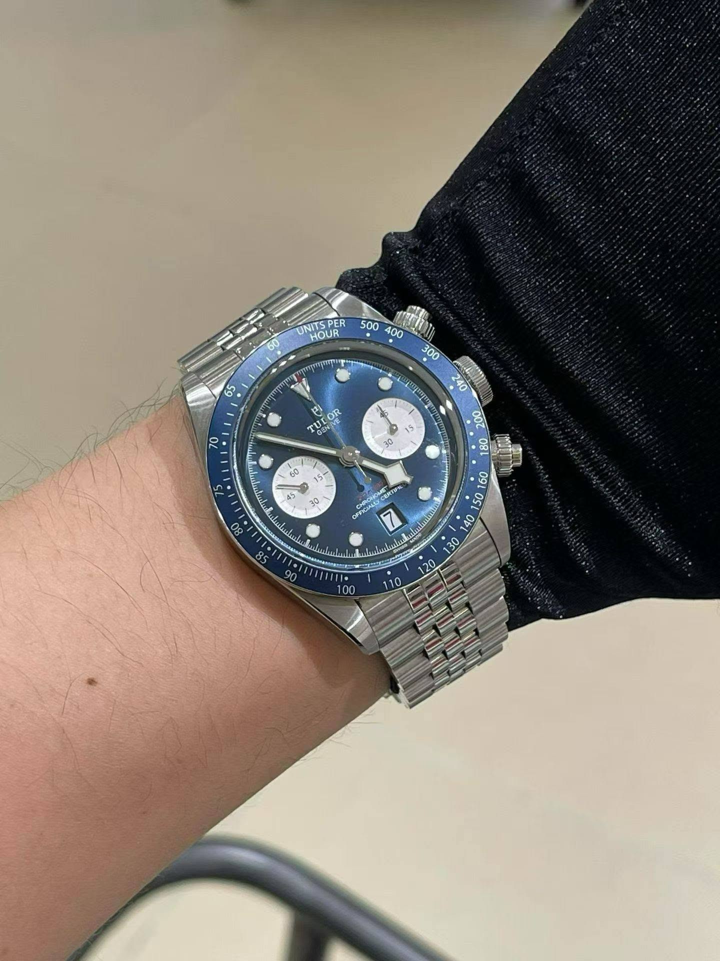 May be an image of wrist watch and text