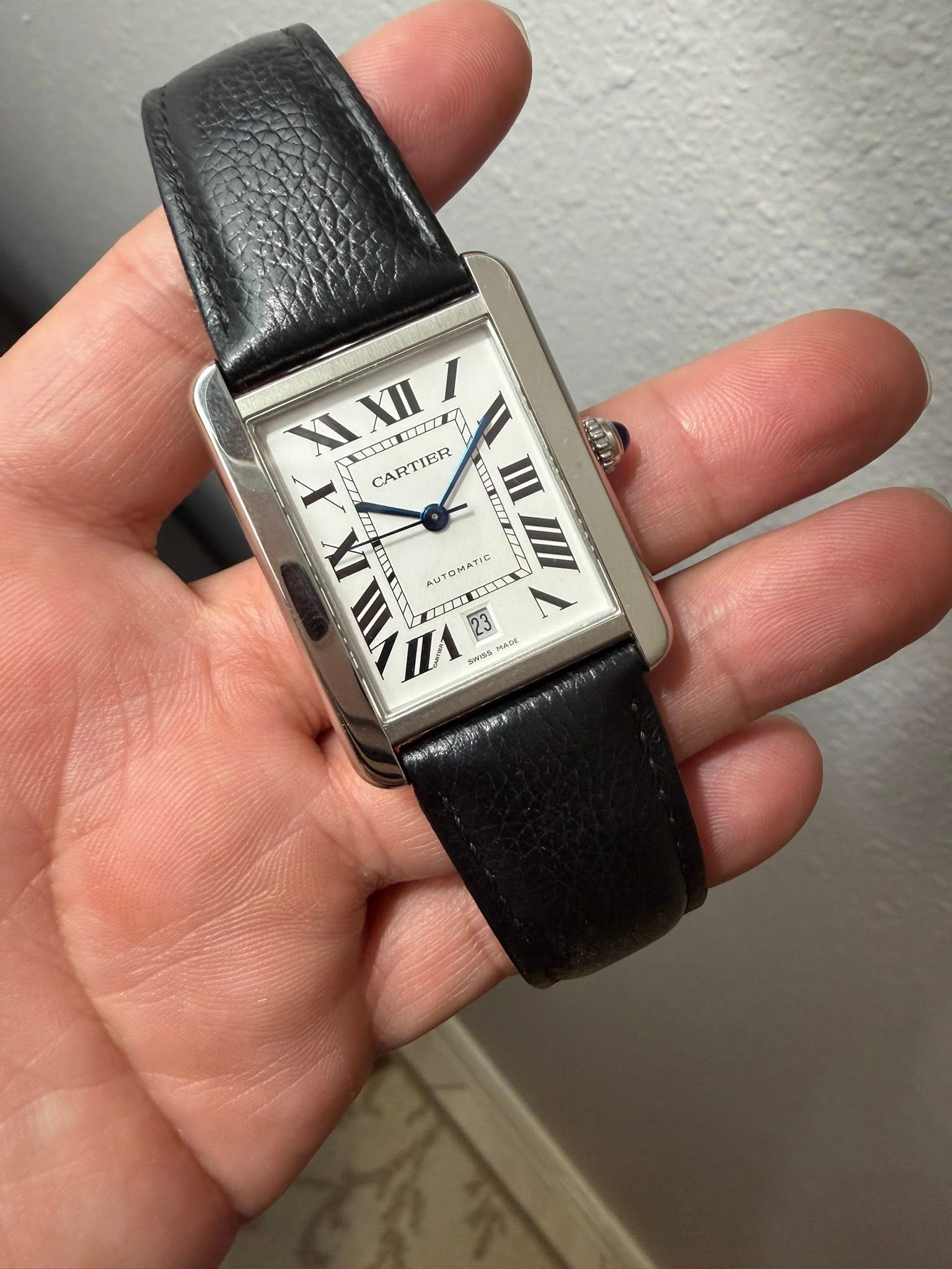 May be an image of wrist watch