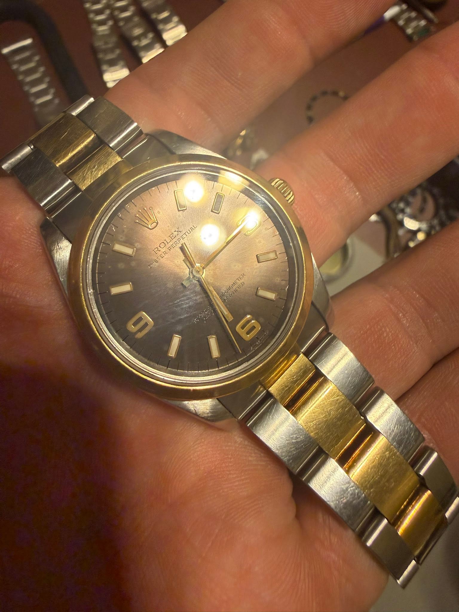 May be an image of wrist watch and text