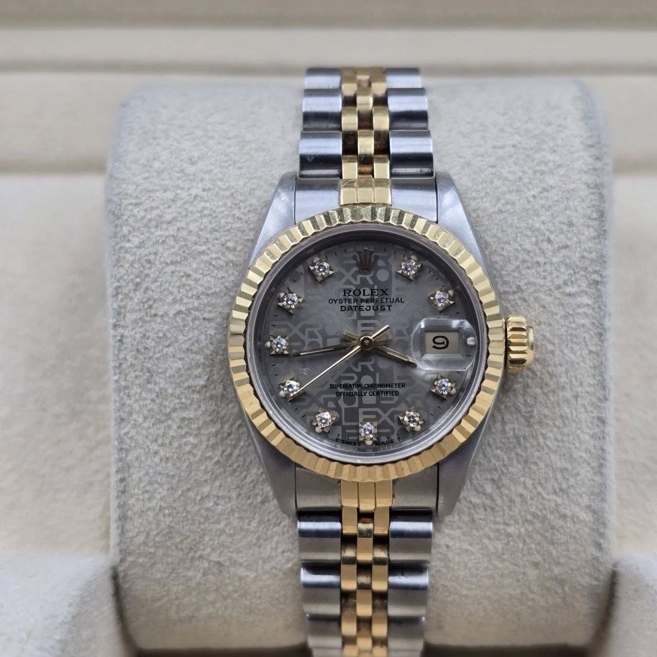 May be an image of wrist watch and text